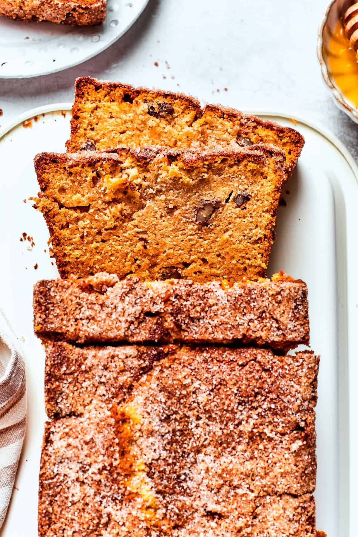 A loaf of Amish friendship bread with three slices cut from it.