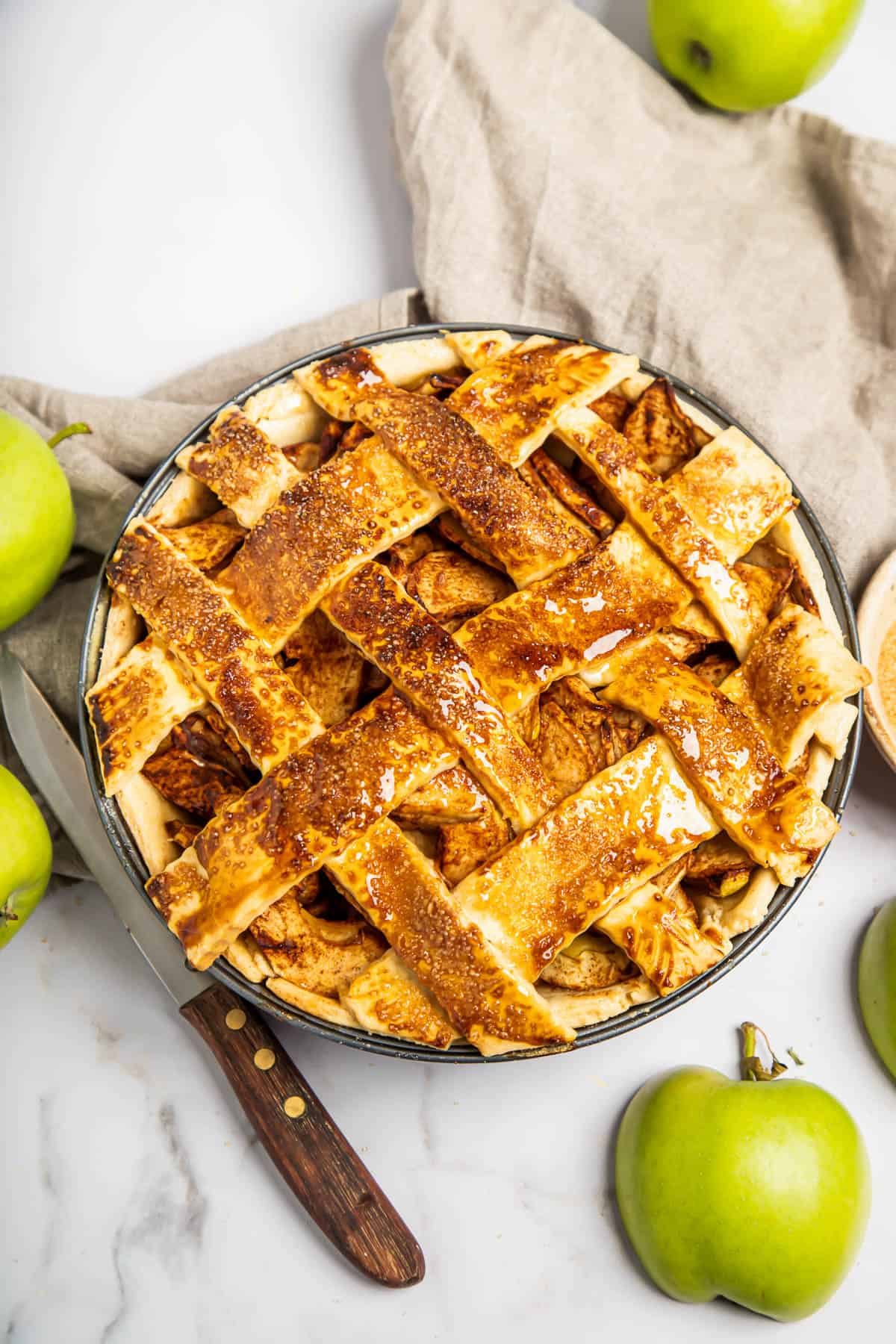 A homemade apple pie with a lattice top.
