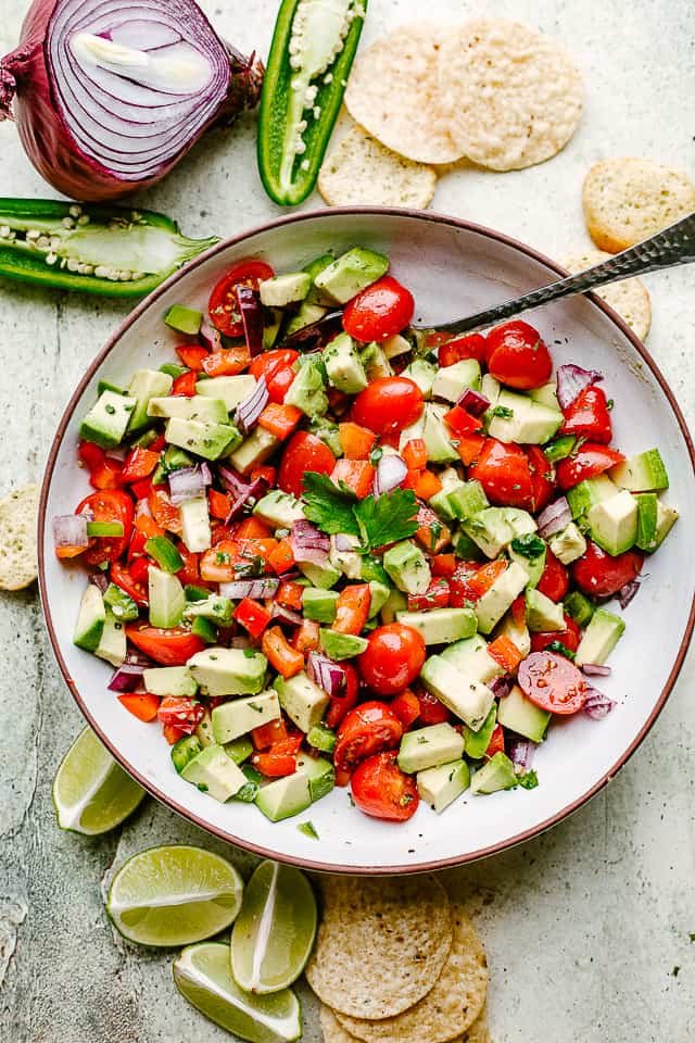 Bowl of homemade avocado salsa with tortilla chips