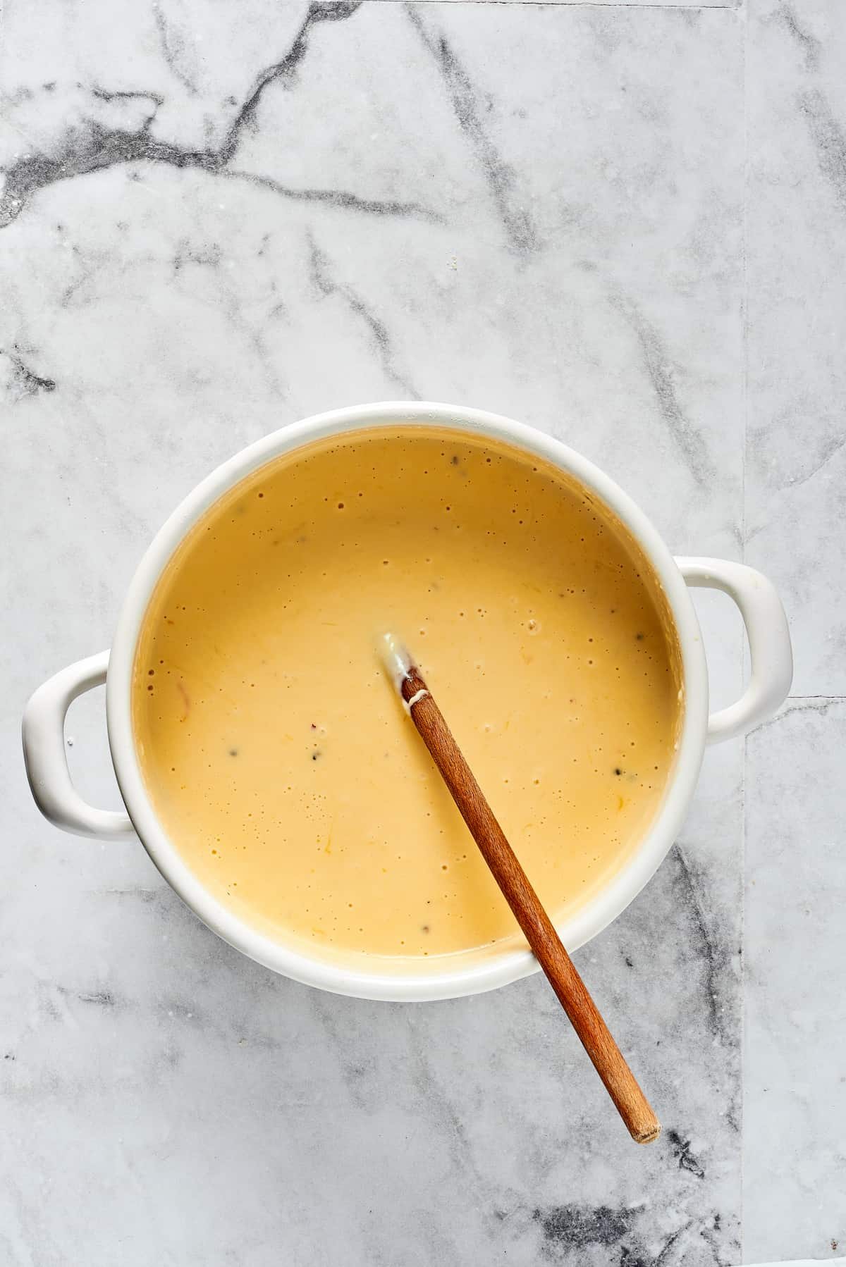 Cheese sauce in a Dutch oven.