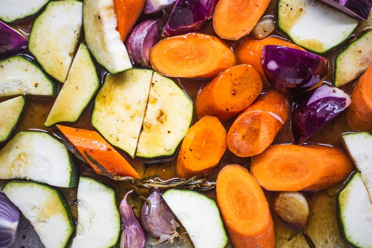 Vegetables in a roasting pan.