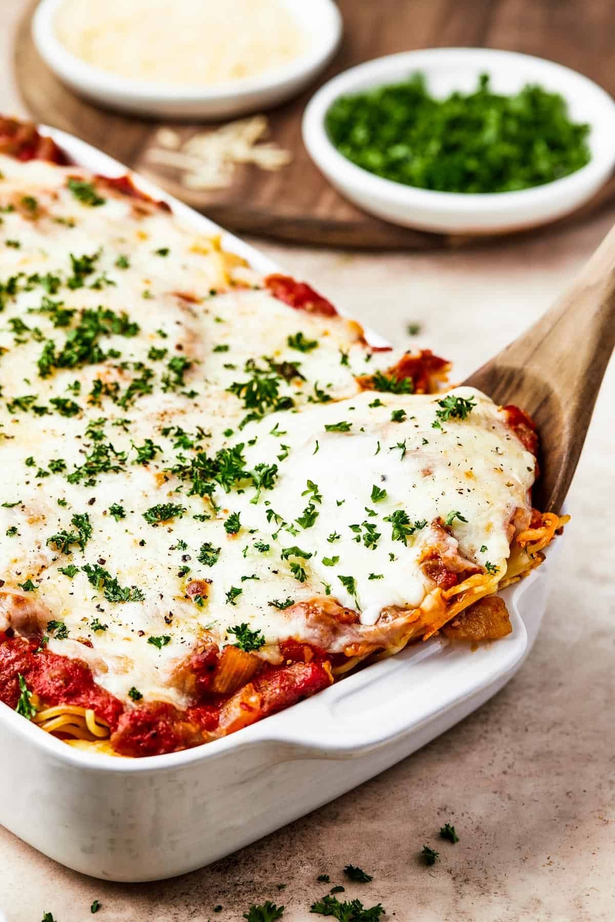 Spaghetti casserole in a white baking dish.