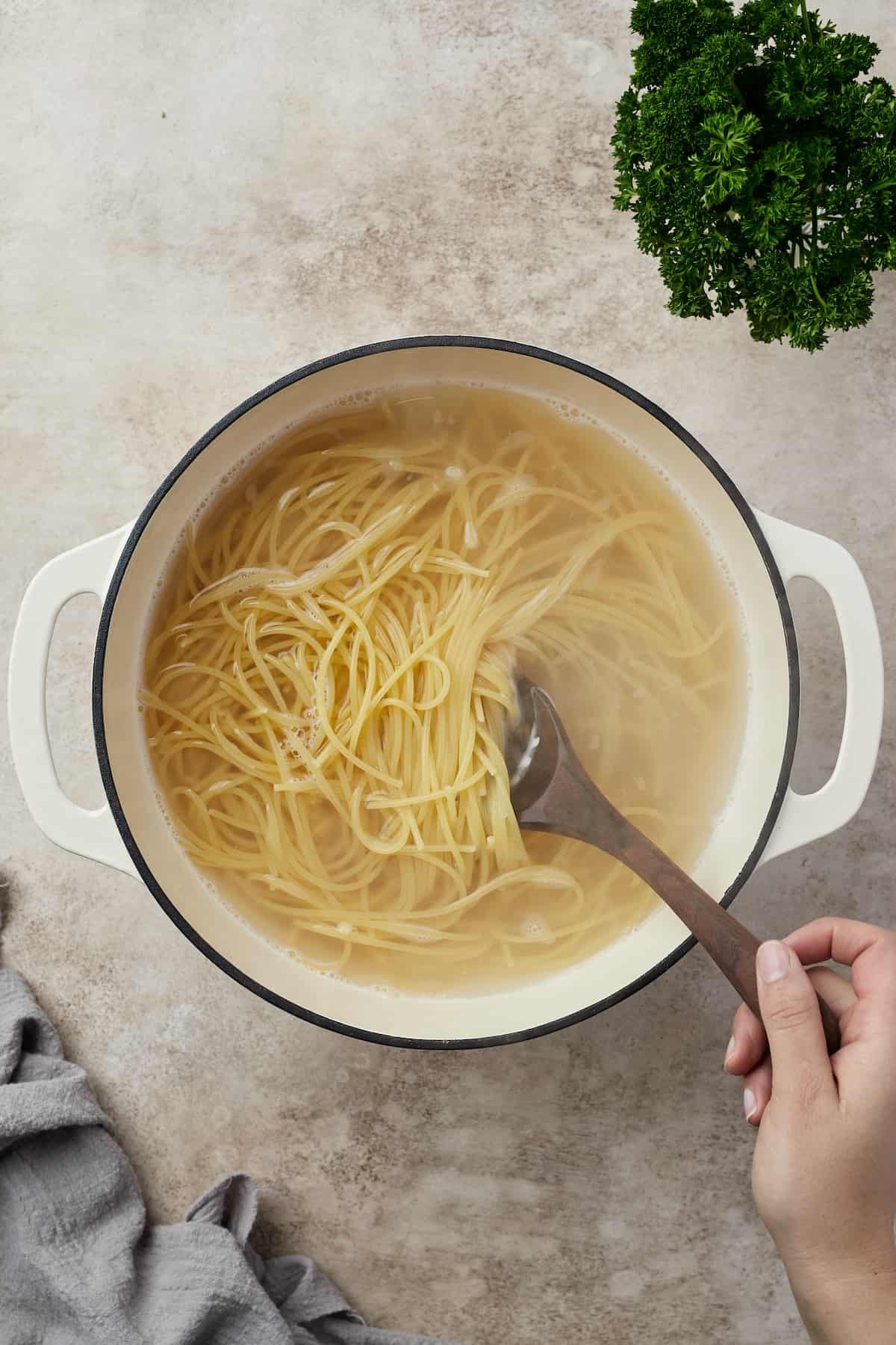 Pasta boiling in a Dutch oven.