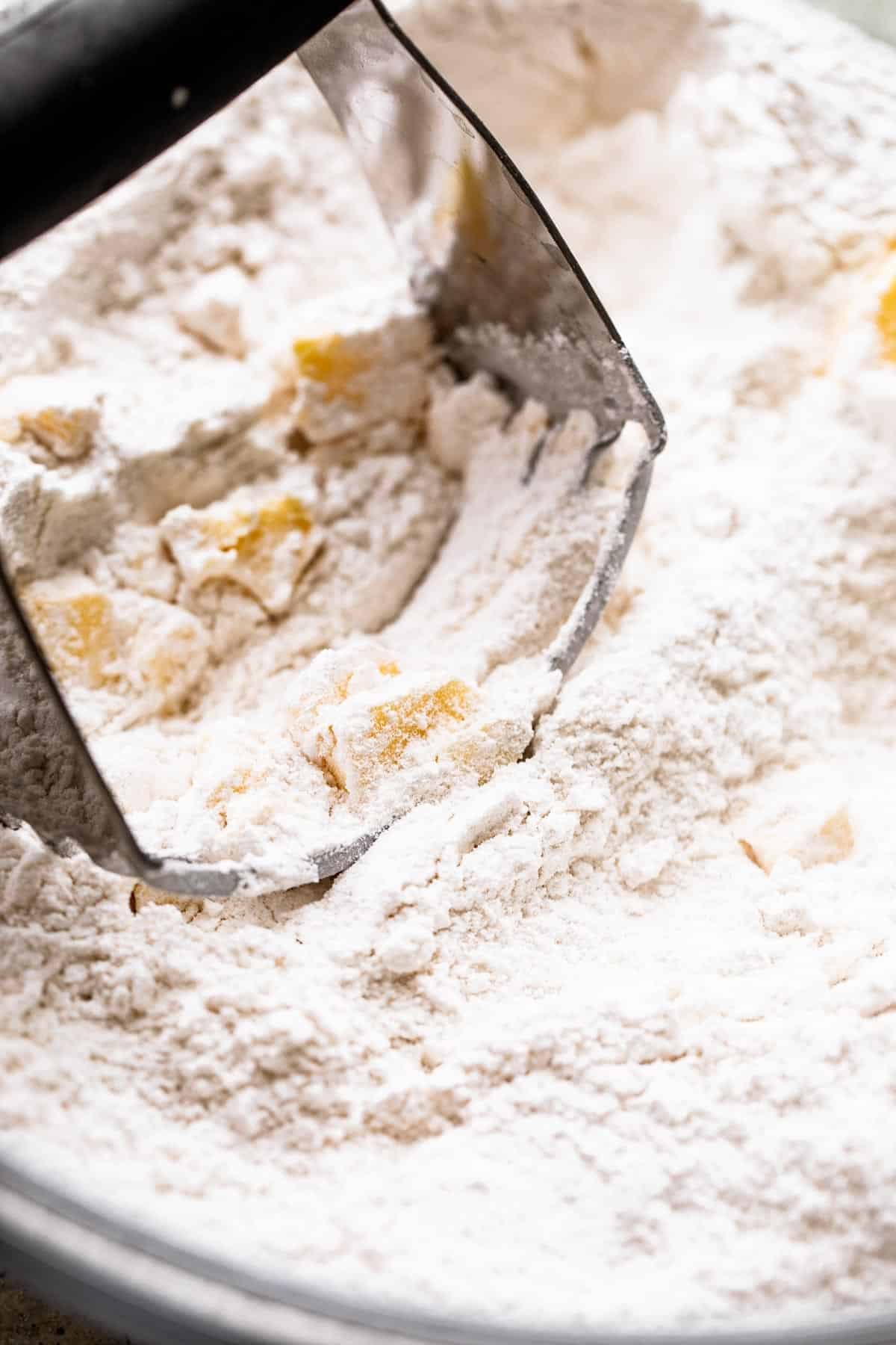 cutting butter into flour with a pastry blender.