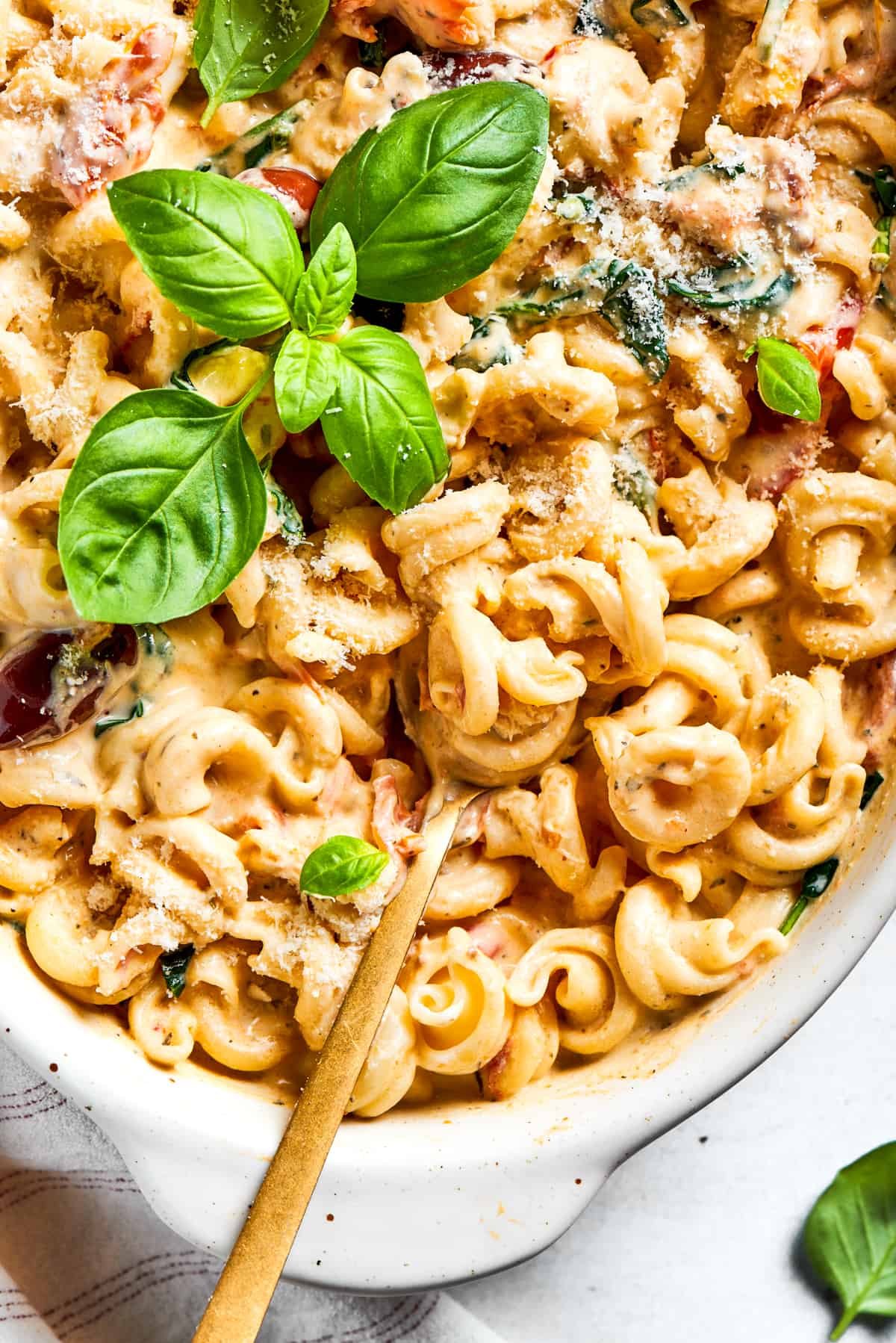 Up close image of Boursin pasta with a spoon mixing through it.