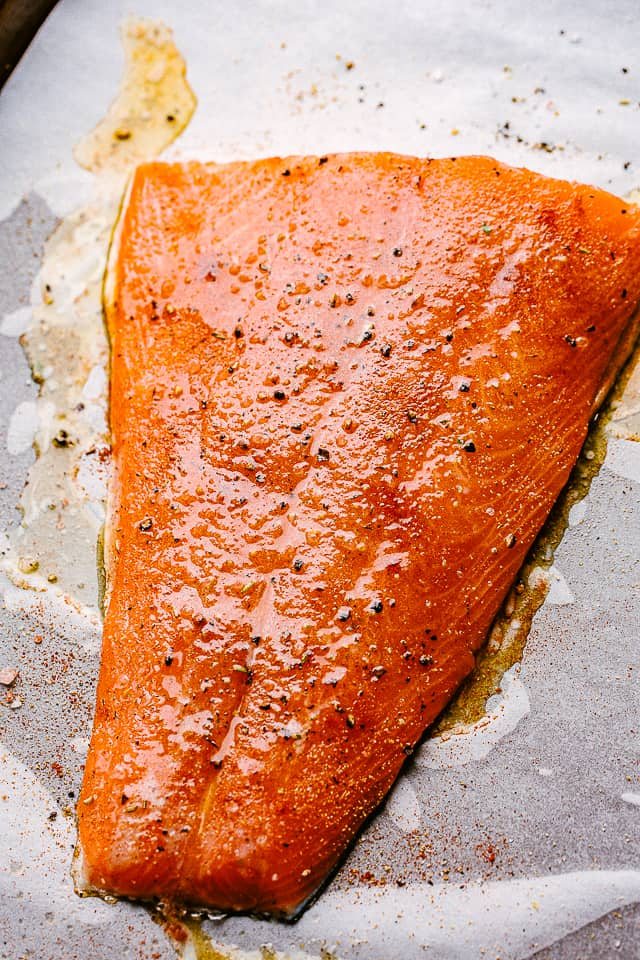 raw salmon topped with olive oil and black pepper