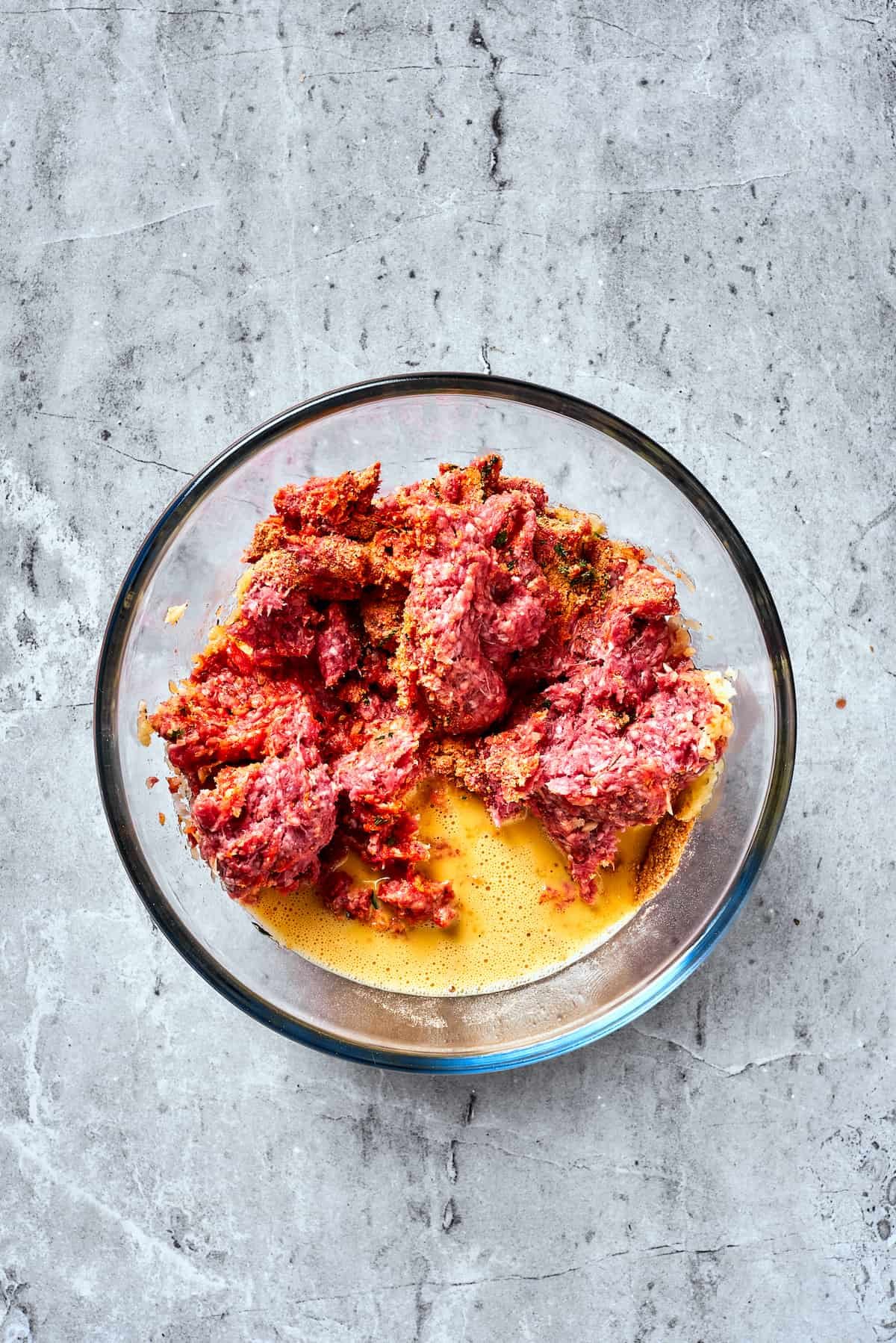 Eggs are mixed into a meatloaf base.