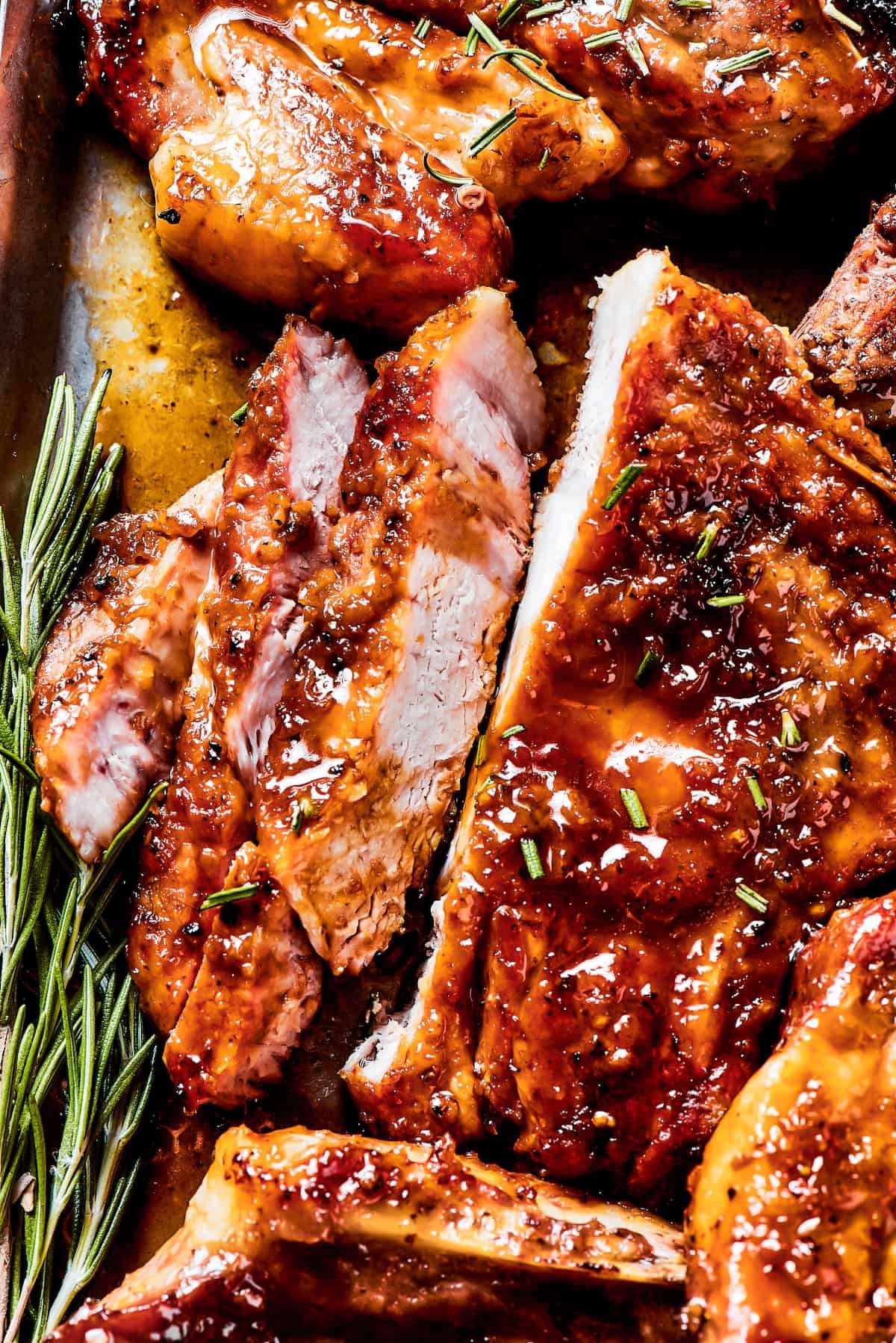 A pork chop sliced to show the perfectly cooked interior.
