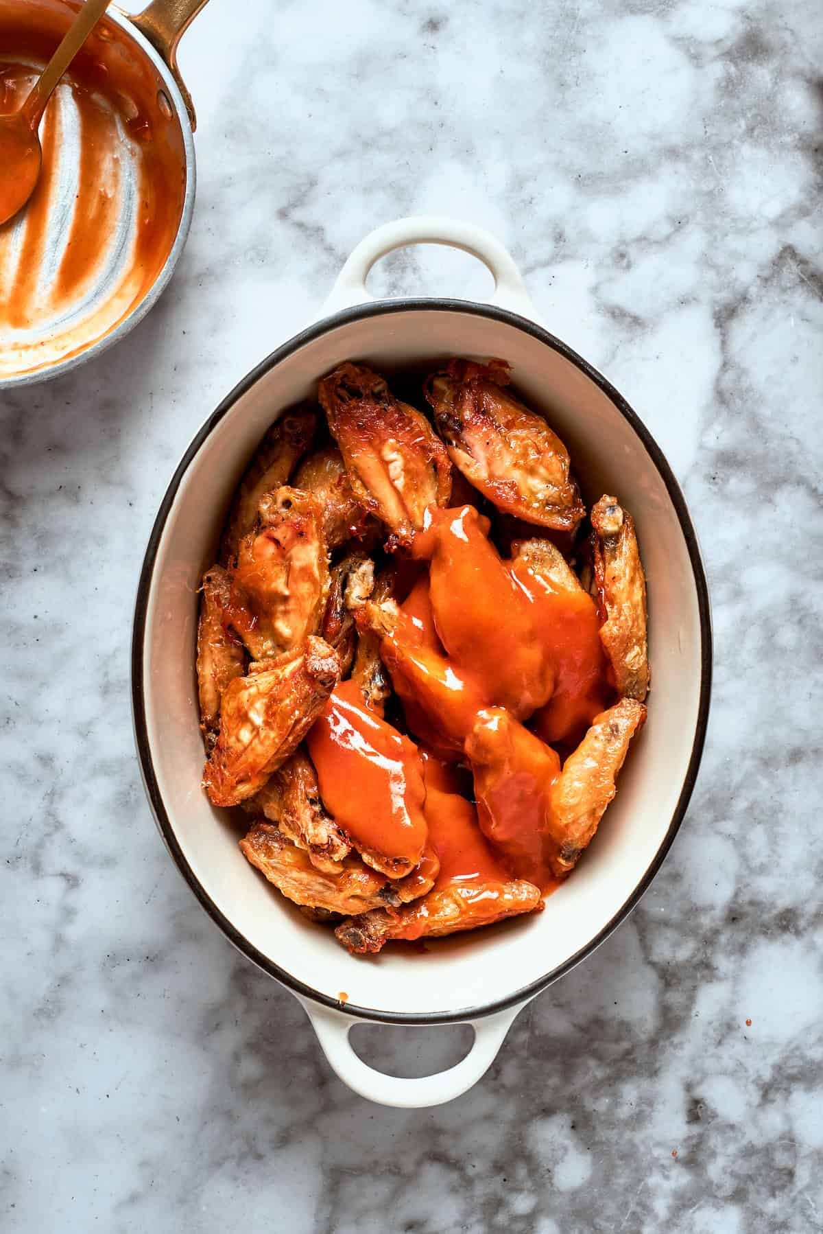 The wings are topped with sauce.