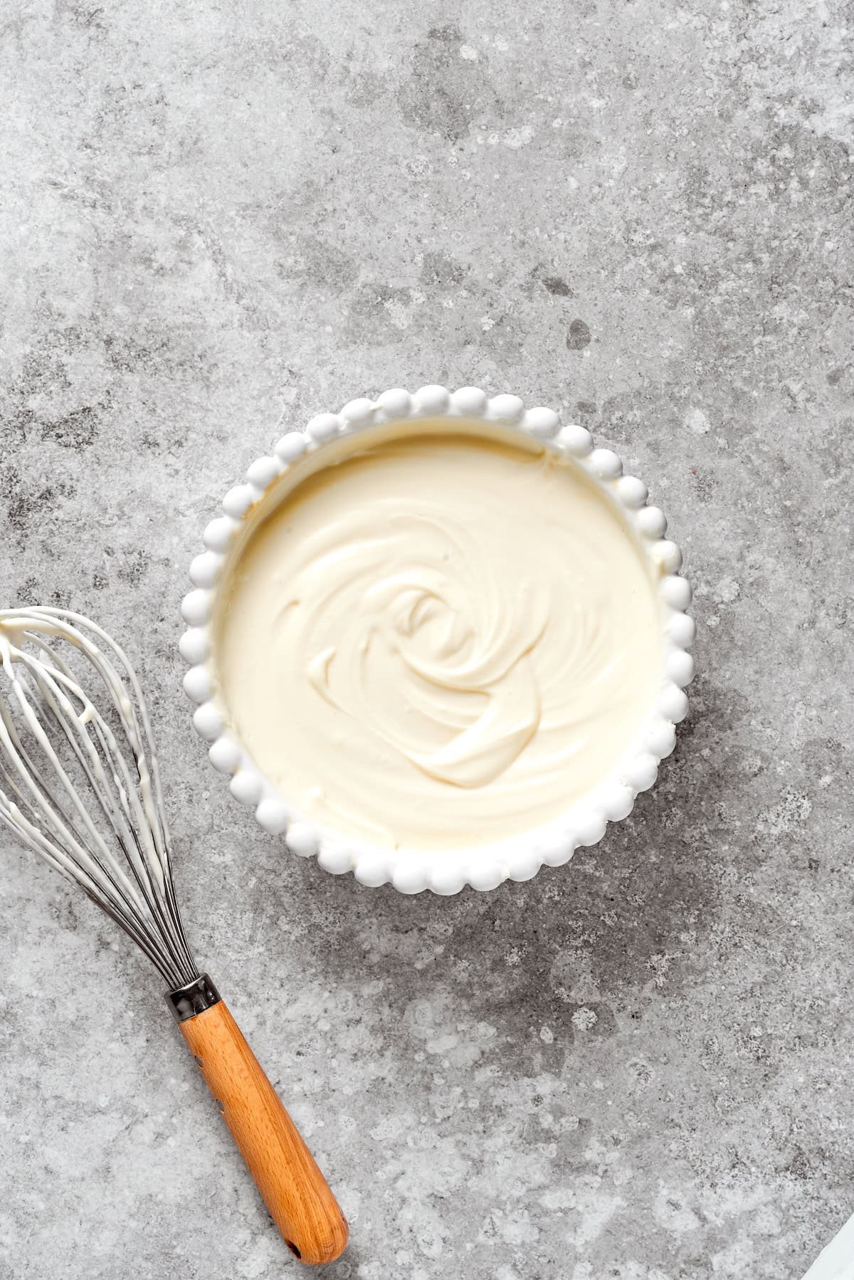 A smooth bowl of cheesecake batter.