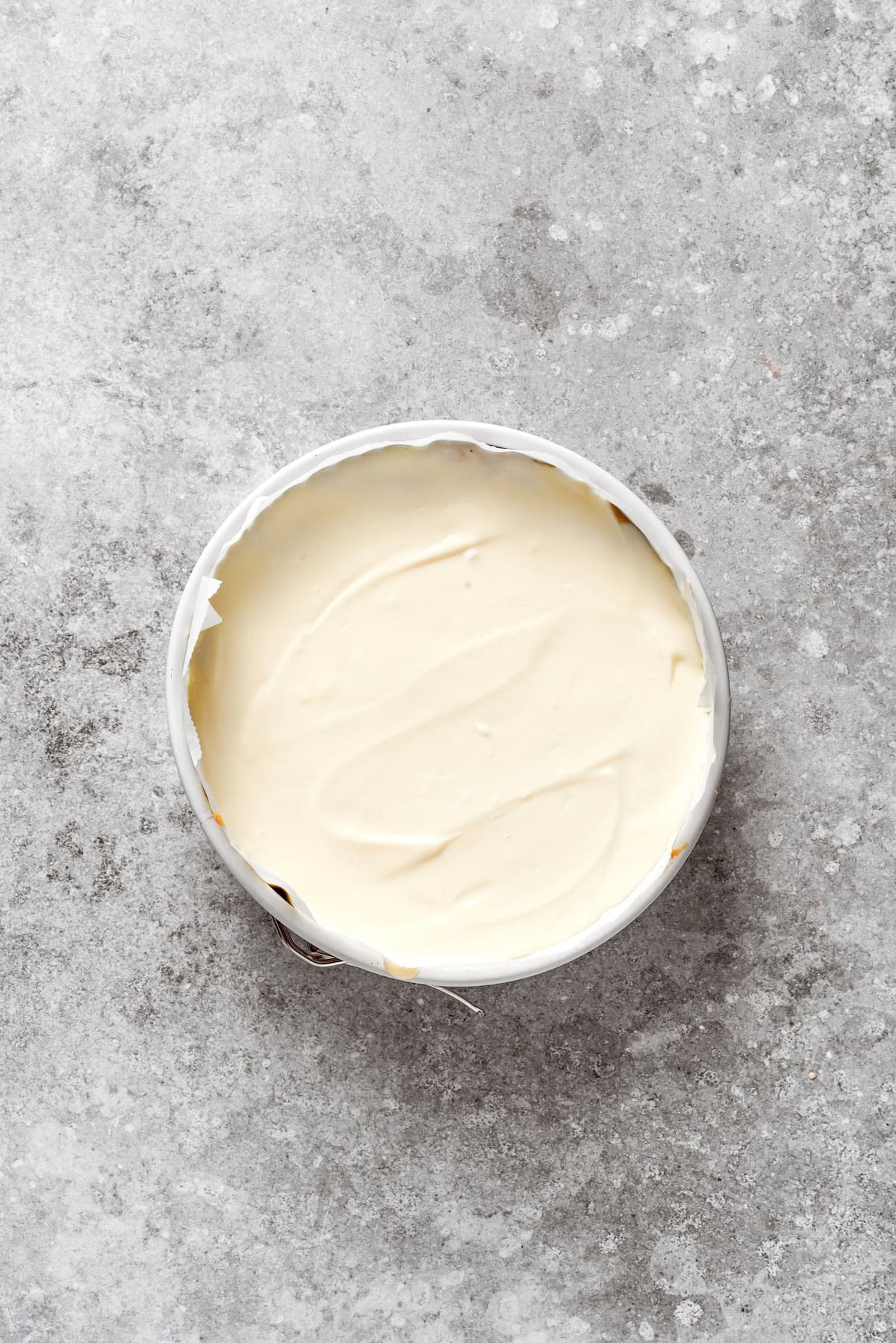 Cheesecake batter is added to carrot cake batter.