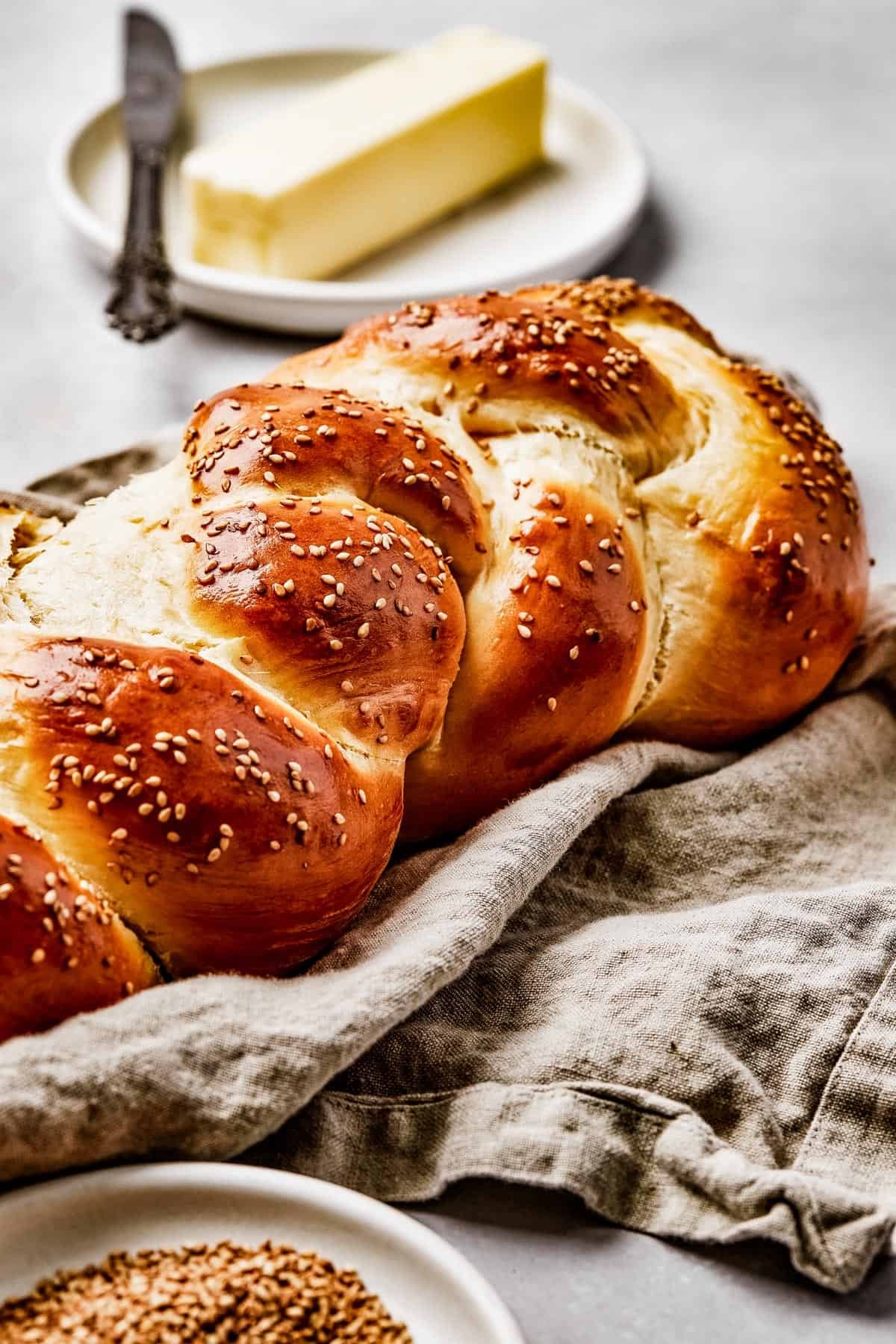 Close-up shot of a challah loaf, to show the texture of the braided sections.
