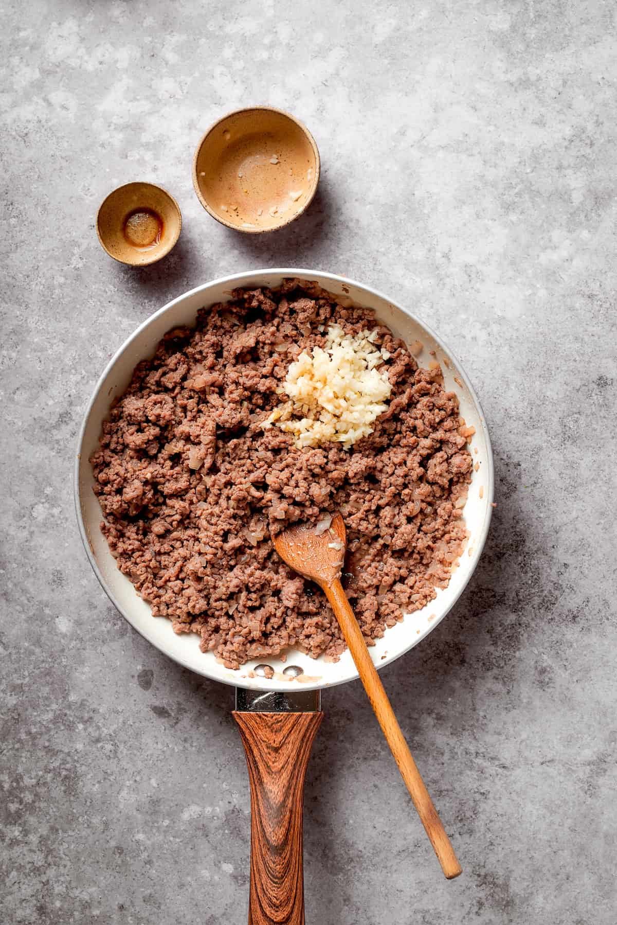 Beef is browned in a skillet.