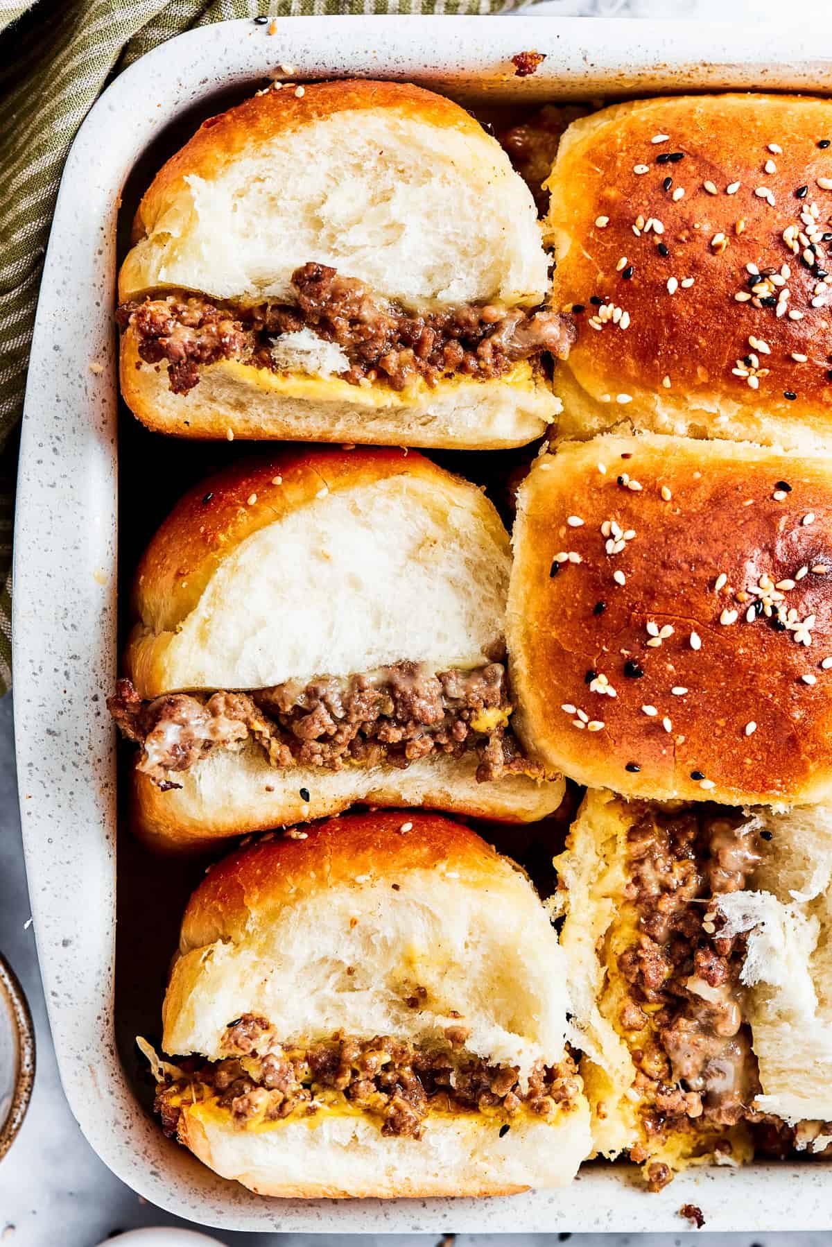 Three cheeseburger sliders.