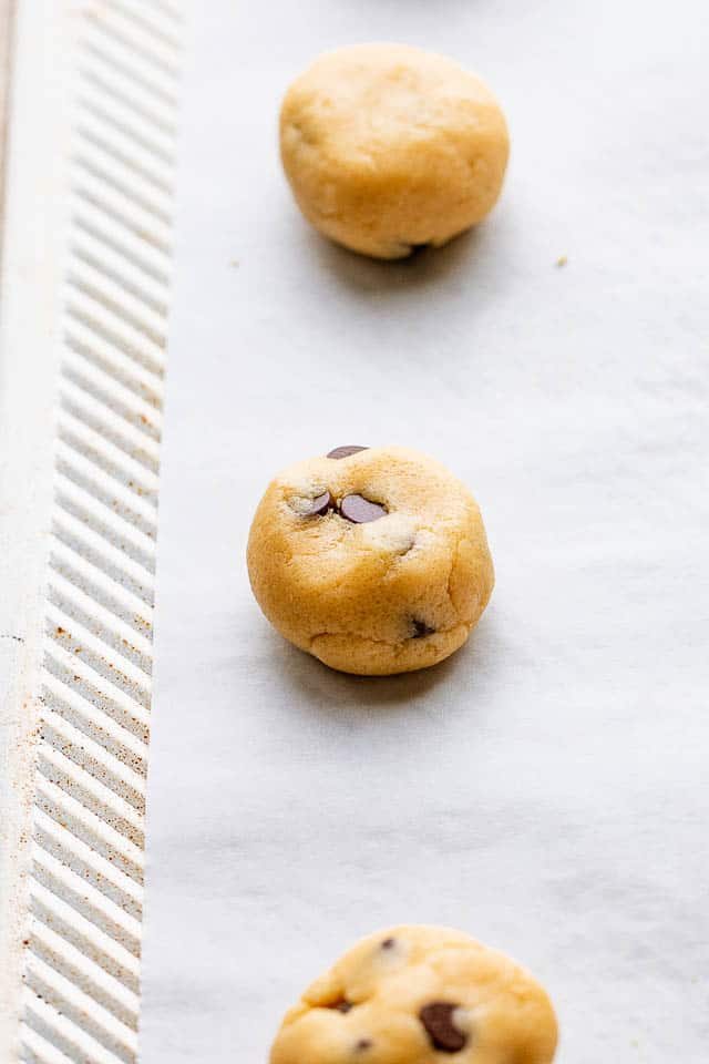 Rolling the cookie dough into balls.