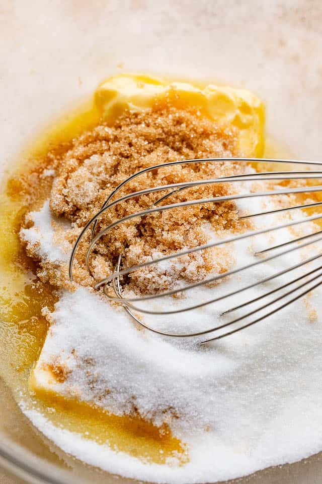 Mixing together cookie ingredients.