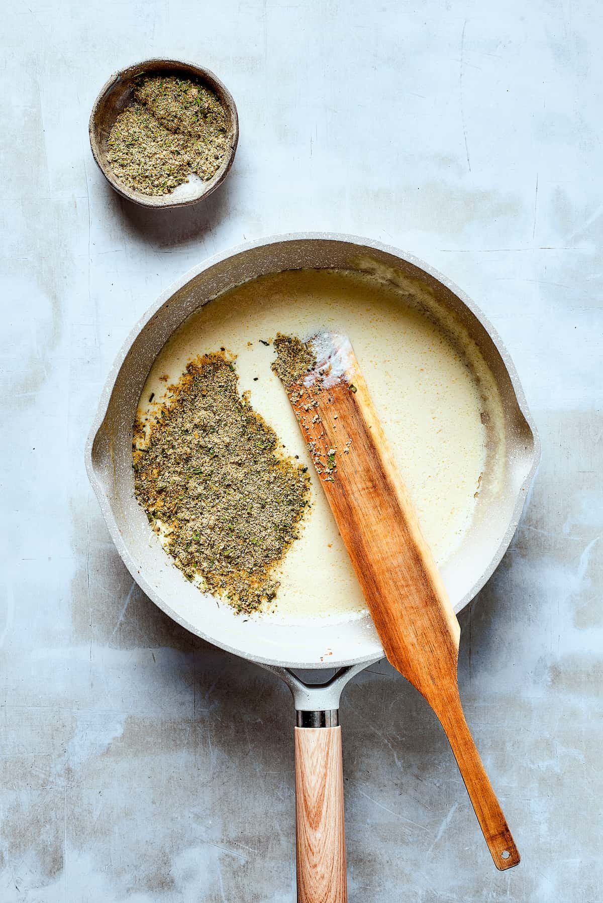 Making creamy sauce in a skillet.