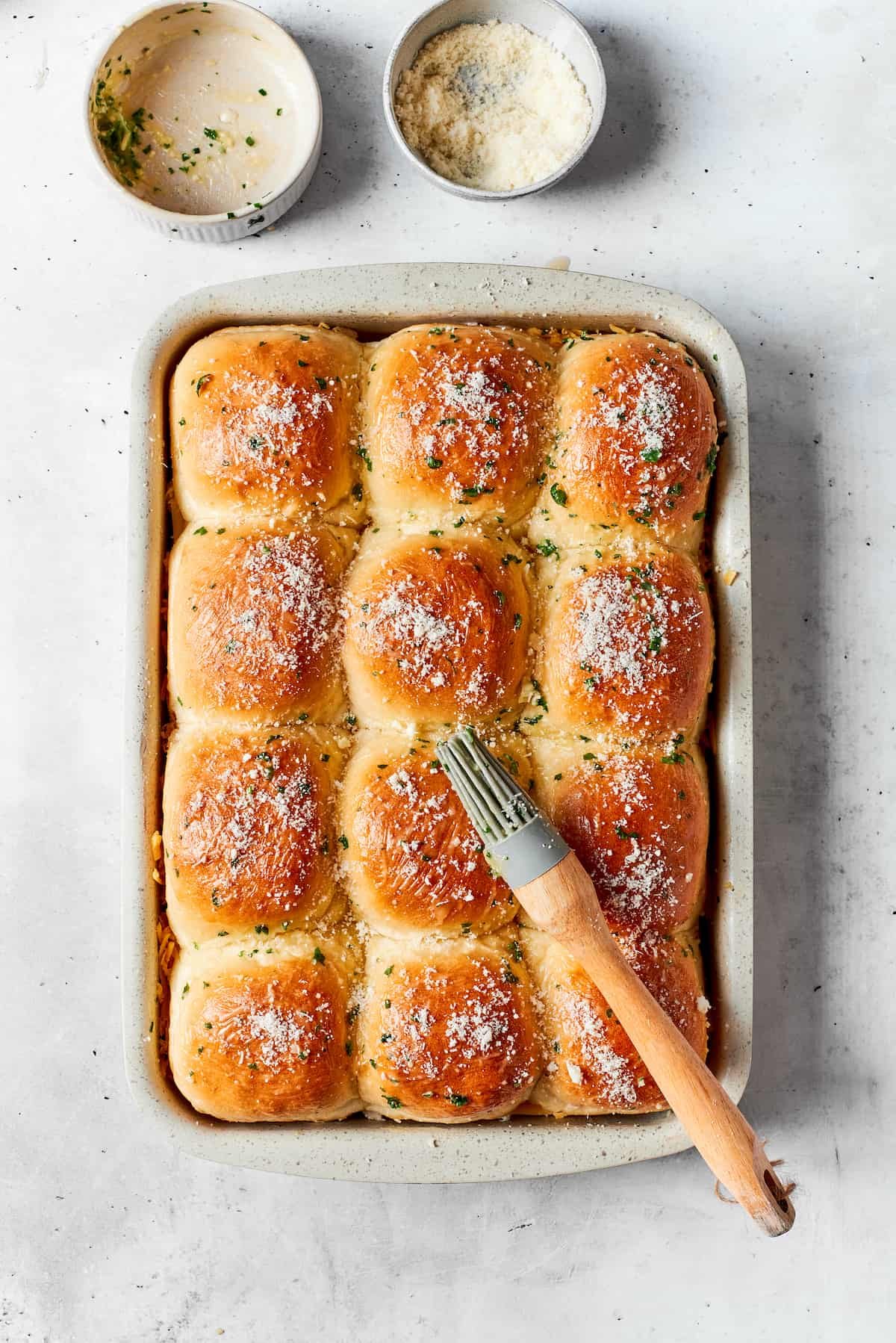 The tops of the sliders are brushed with melted butter.