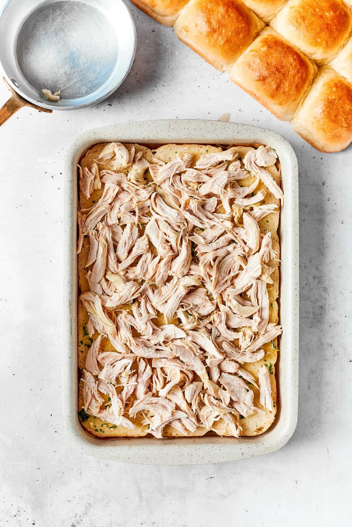 Shredded chicken is added to the chicken bacon ranch sliders.