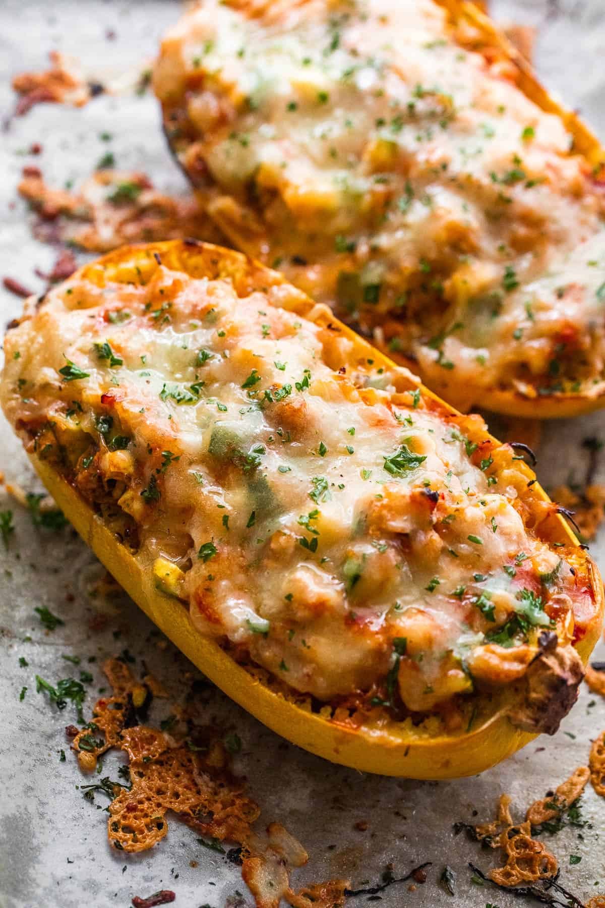 spaghetti squash stuffed with chicken enchilada filling and topped with melted cheese