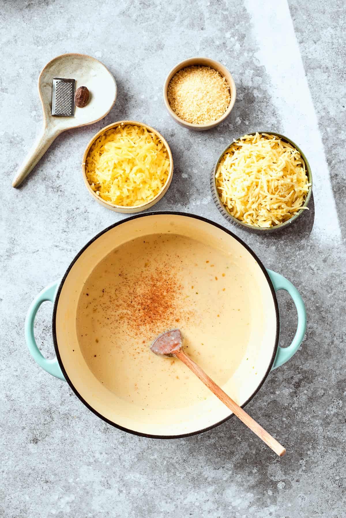 The nutmeg is stirred into the roux.