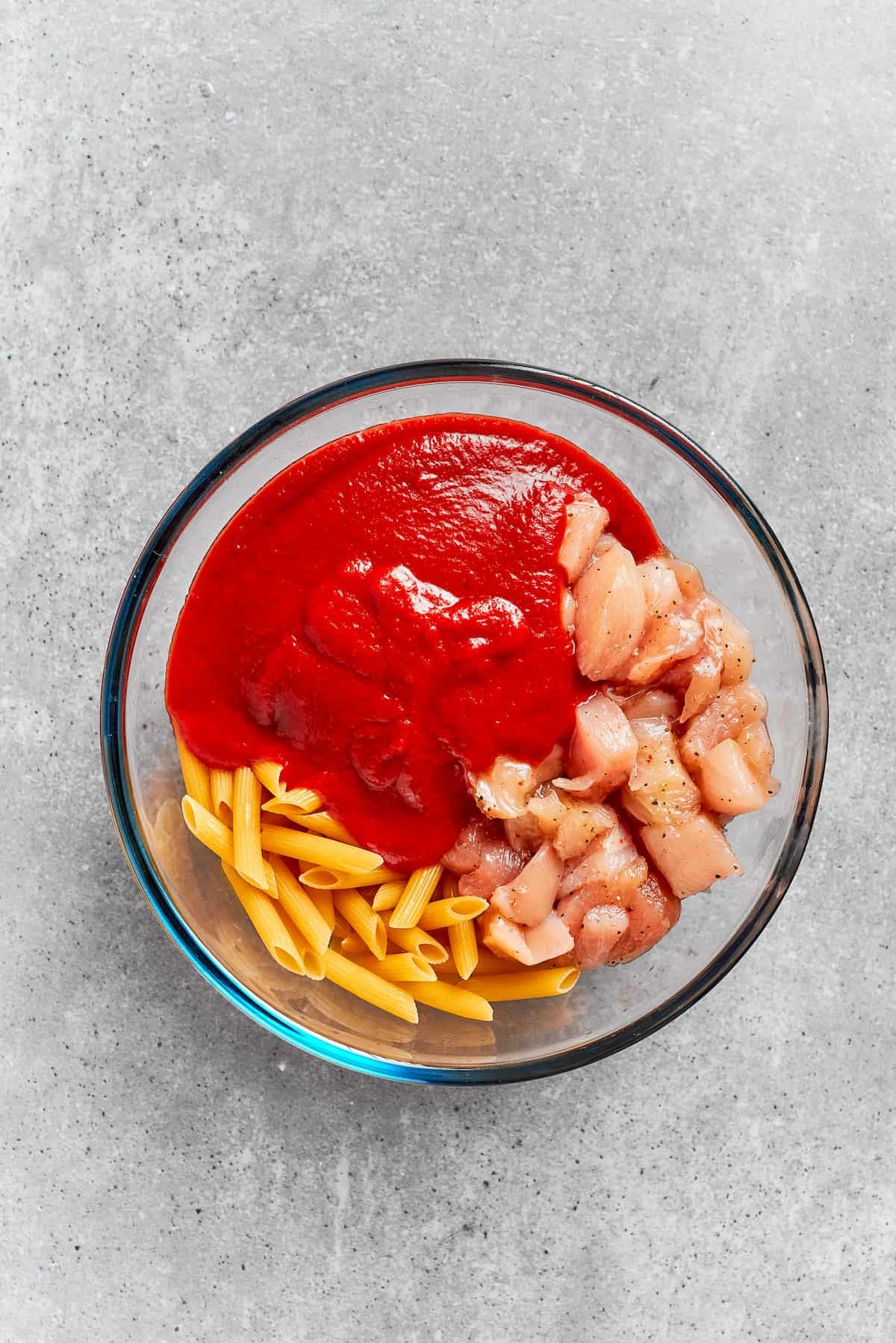 The sauce is added to the bowl.