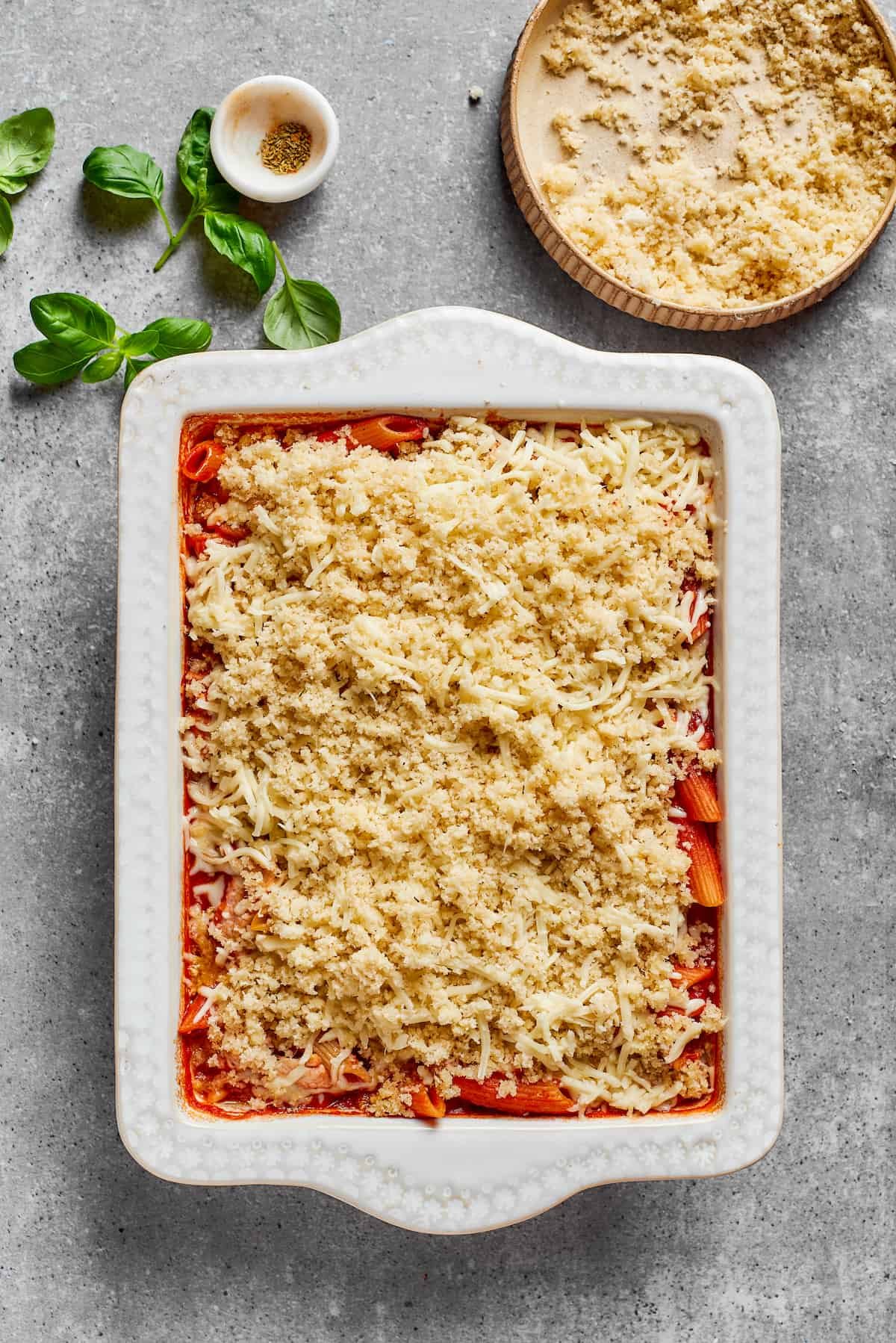 The breadcrumb topping is added to the top of the casserole.