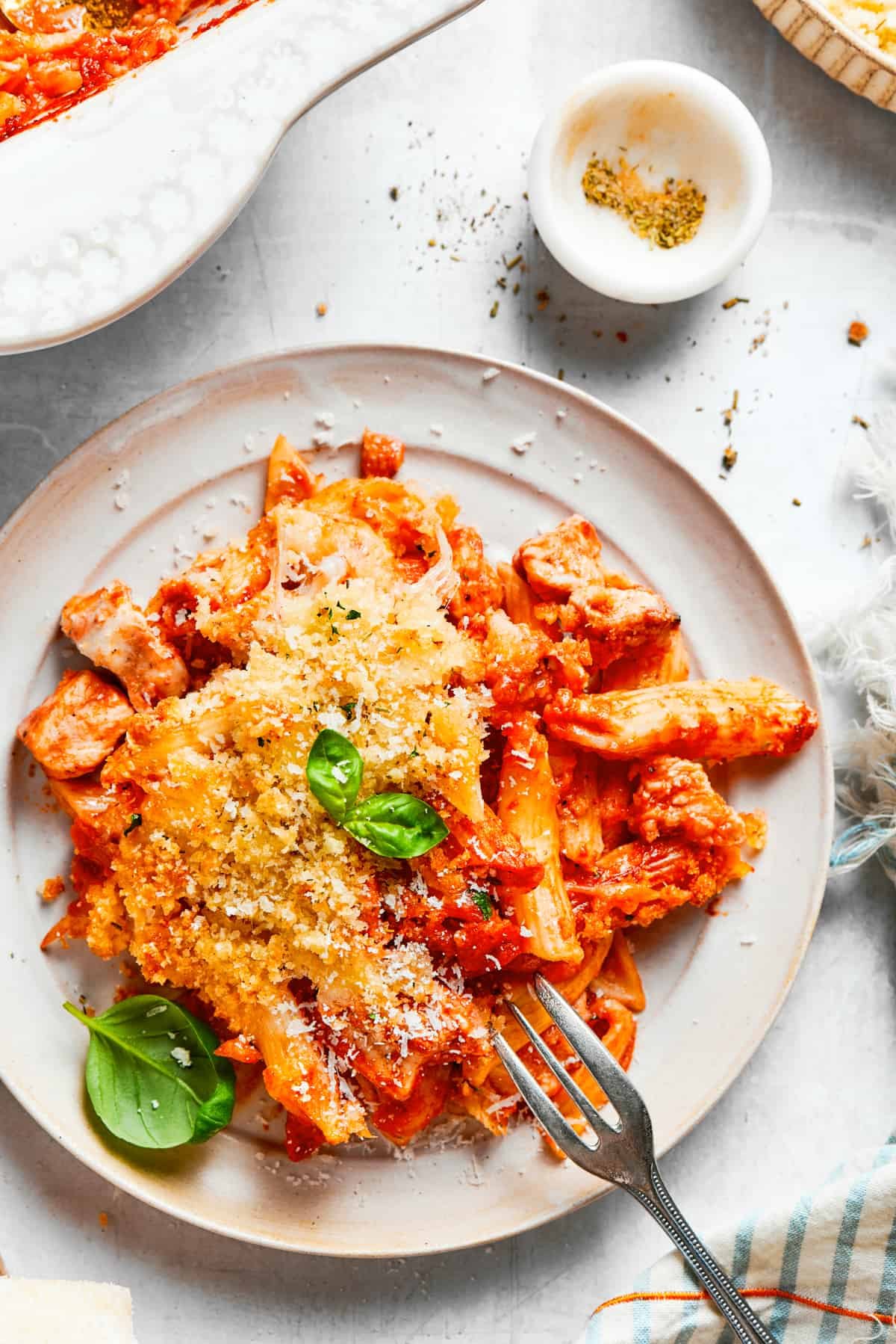 Baked pasta served on a dinner plate.