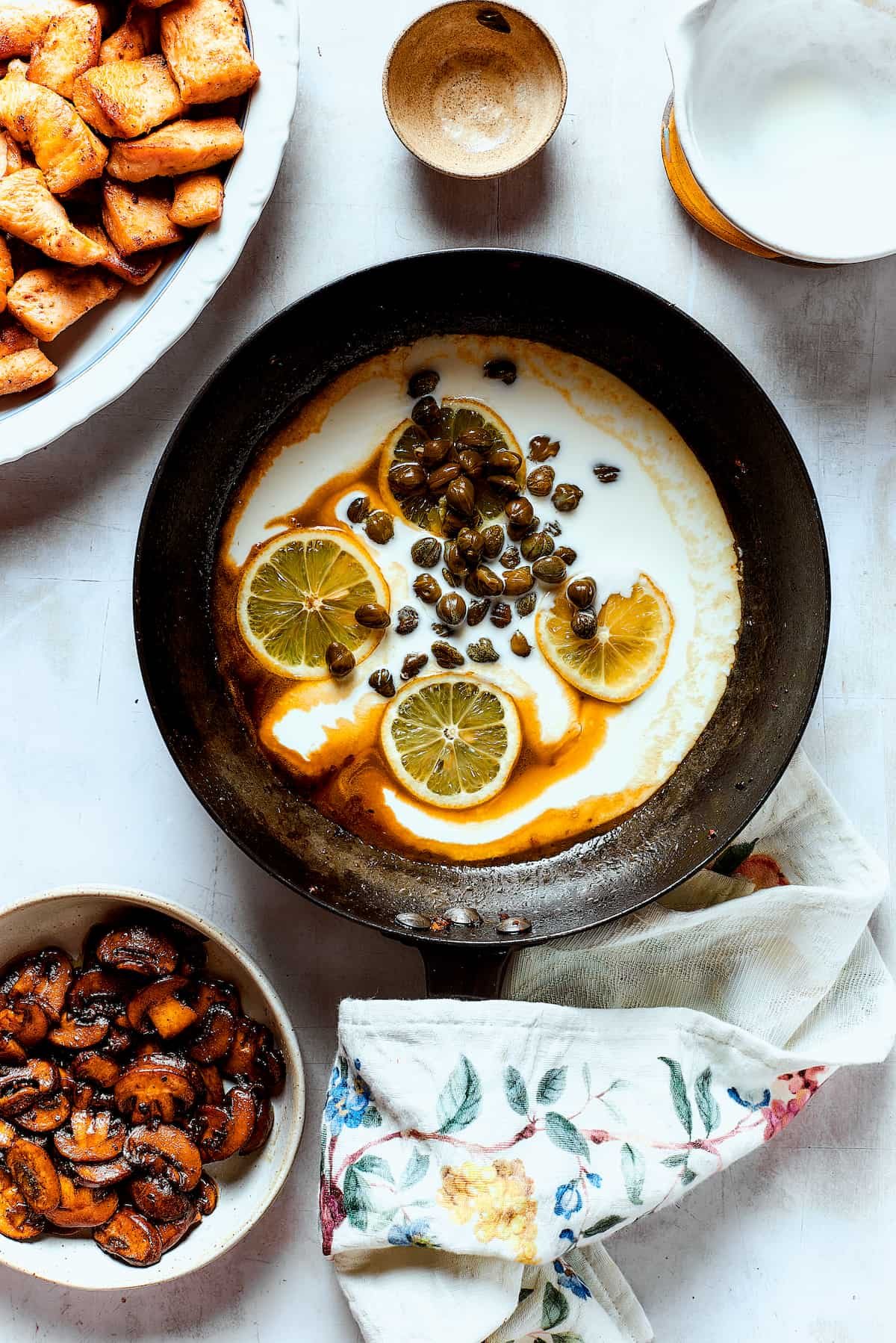 Making a caper and lemon sauce in the skillet.