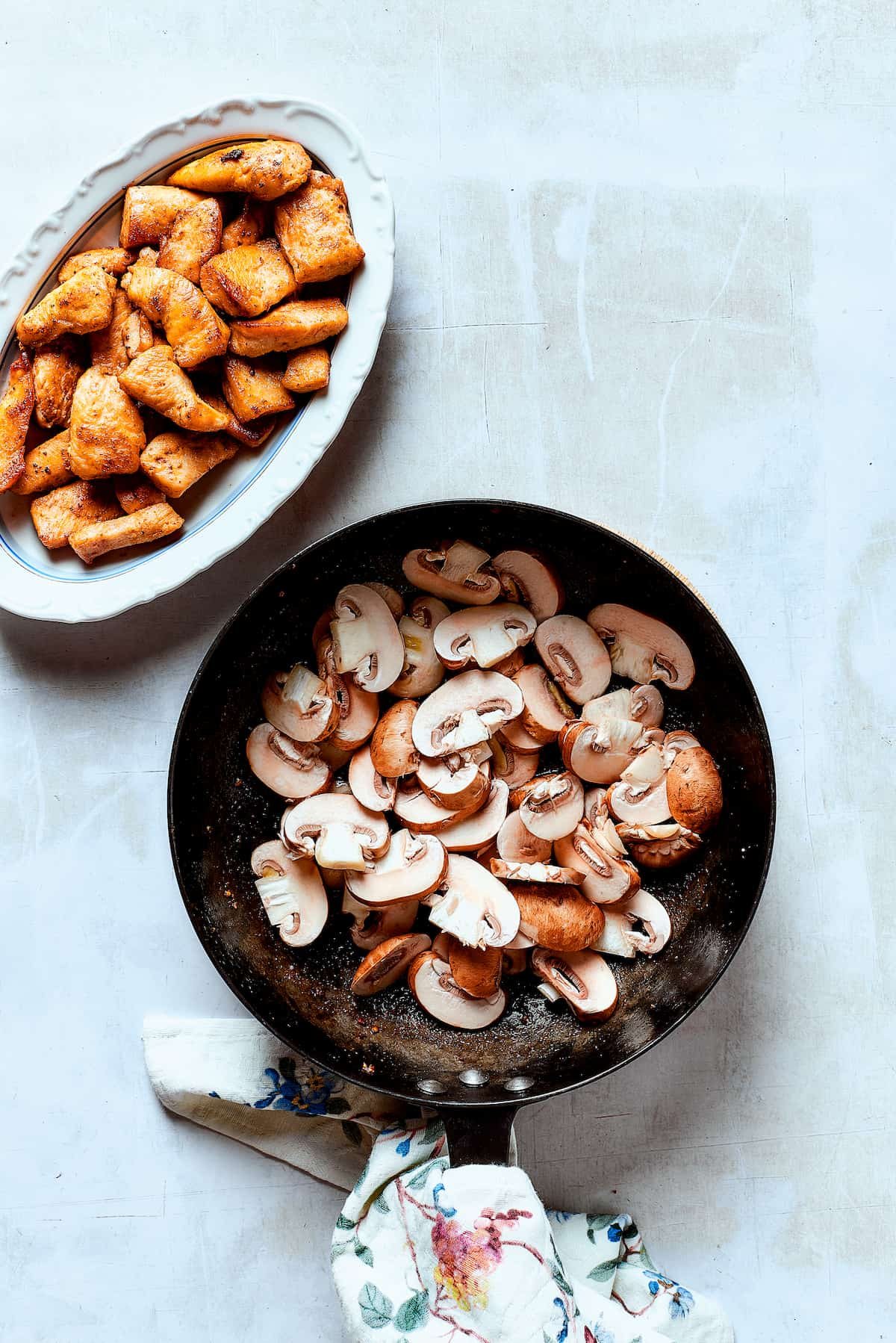 Cooking mushrooms in a skillet.