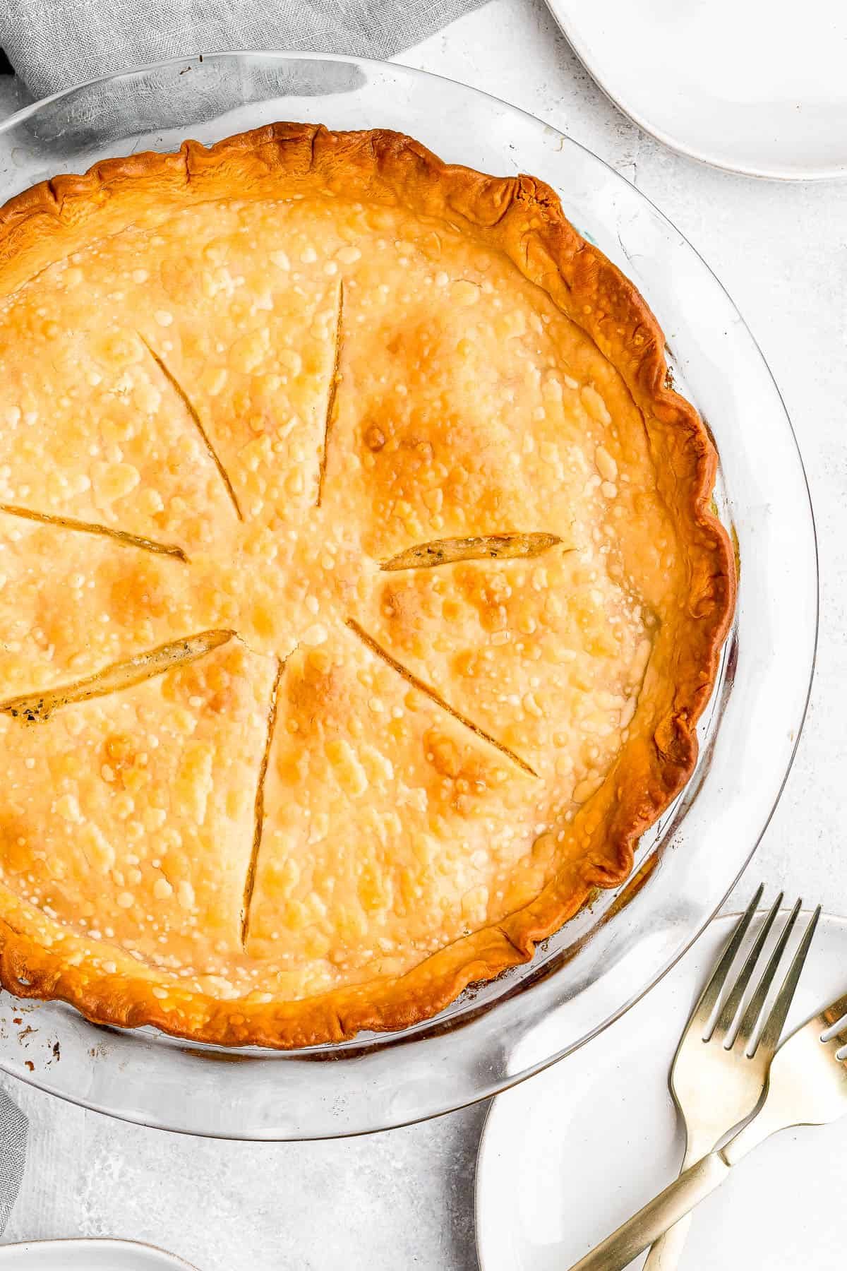 Baked chicken pot pie with slits cut into the top crust for venting.