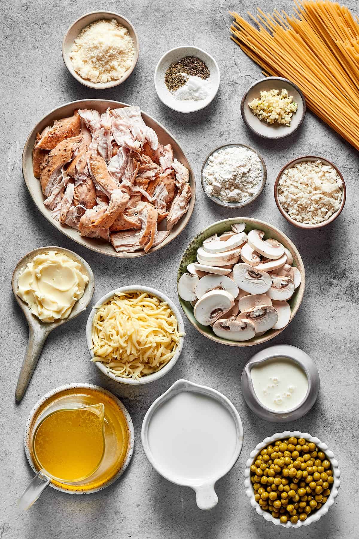 Chicken tetrazzini ingredients measured and arranged on a work surface.