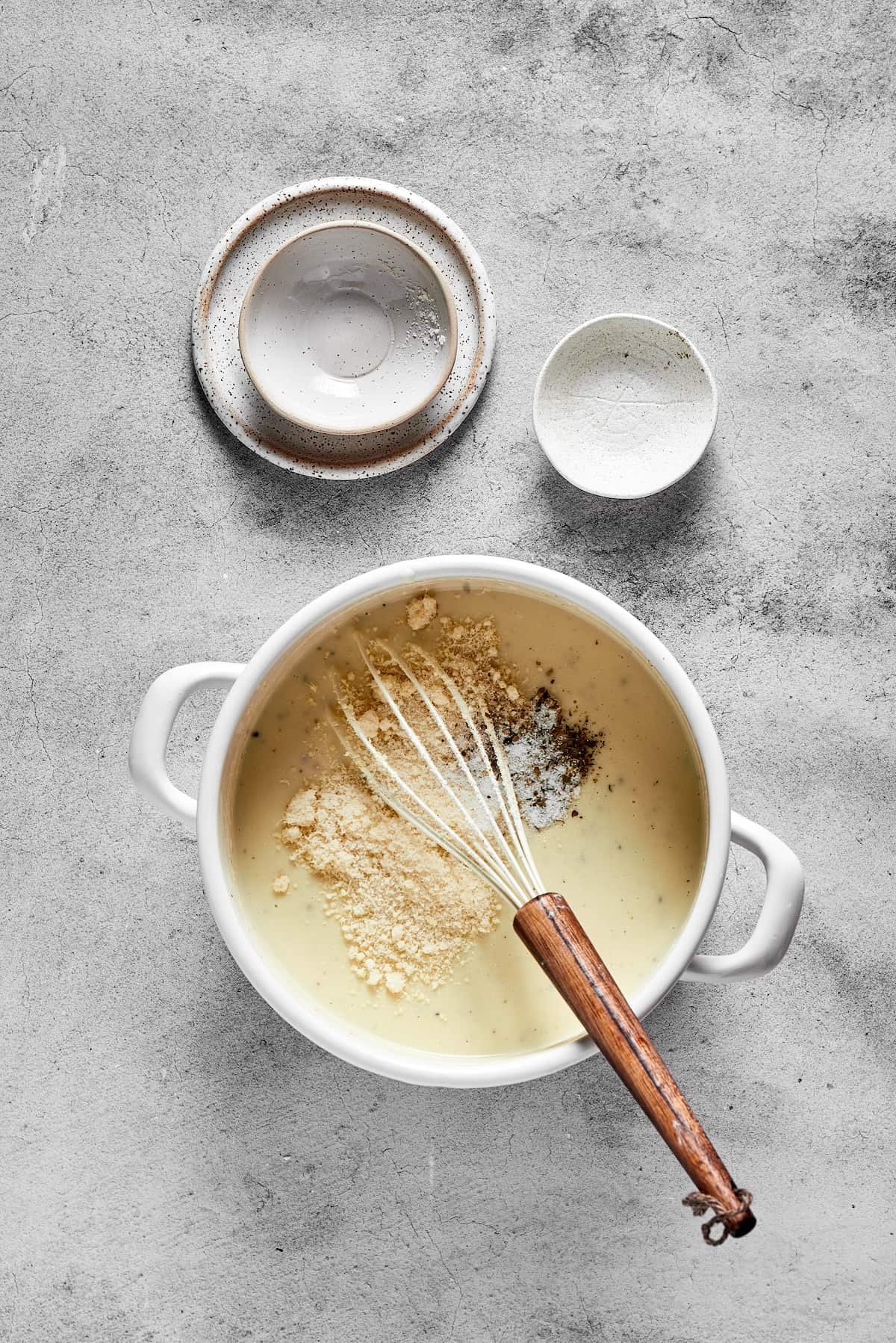 Whisking a creamy sauce.