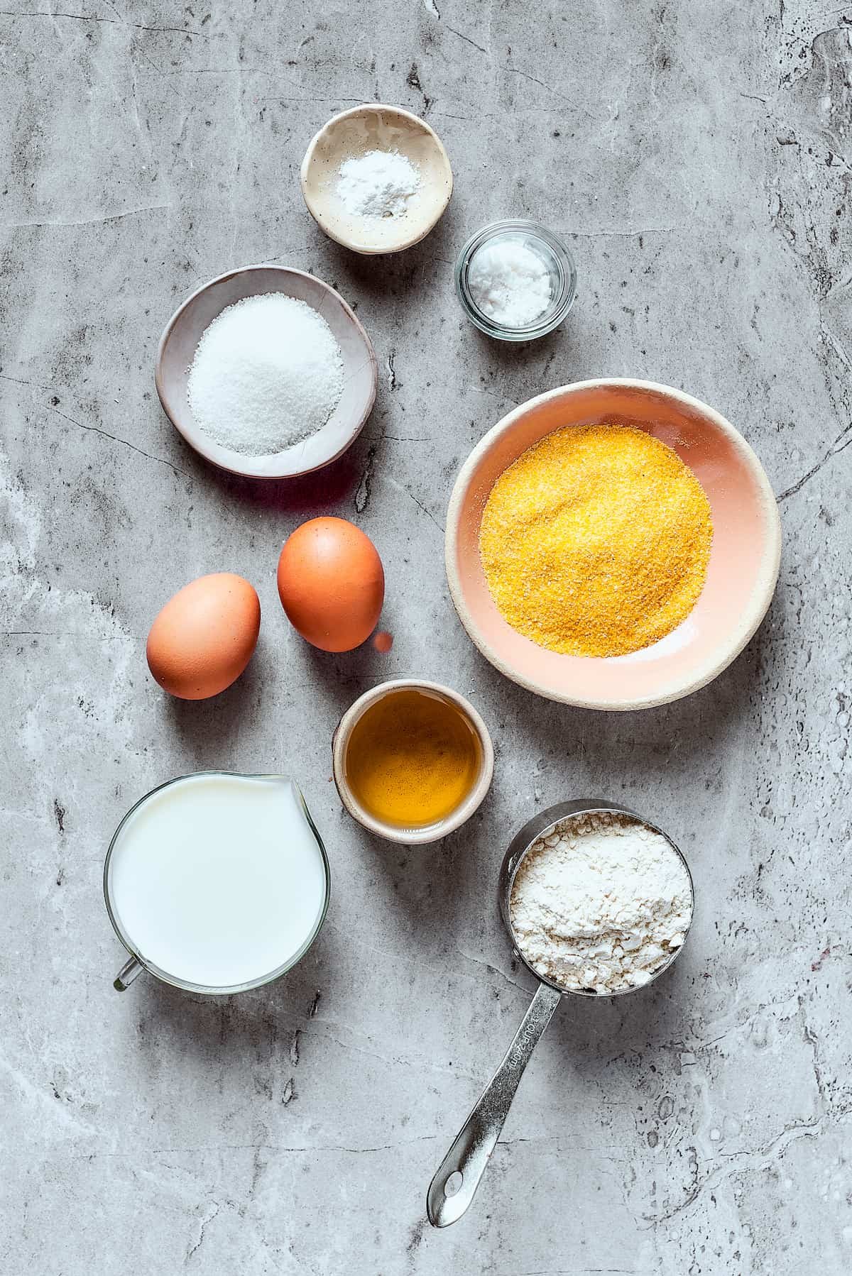 Cornbread ingredients measured and arranged on a work surface.