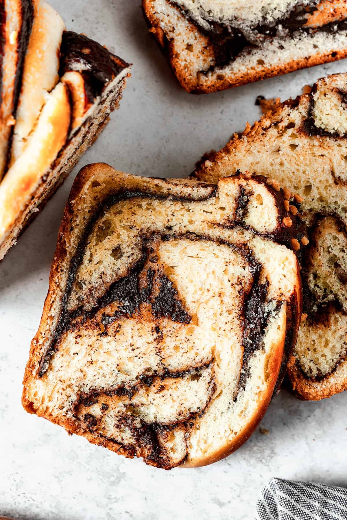 Slices of chocolate babka on a work surface.