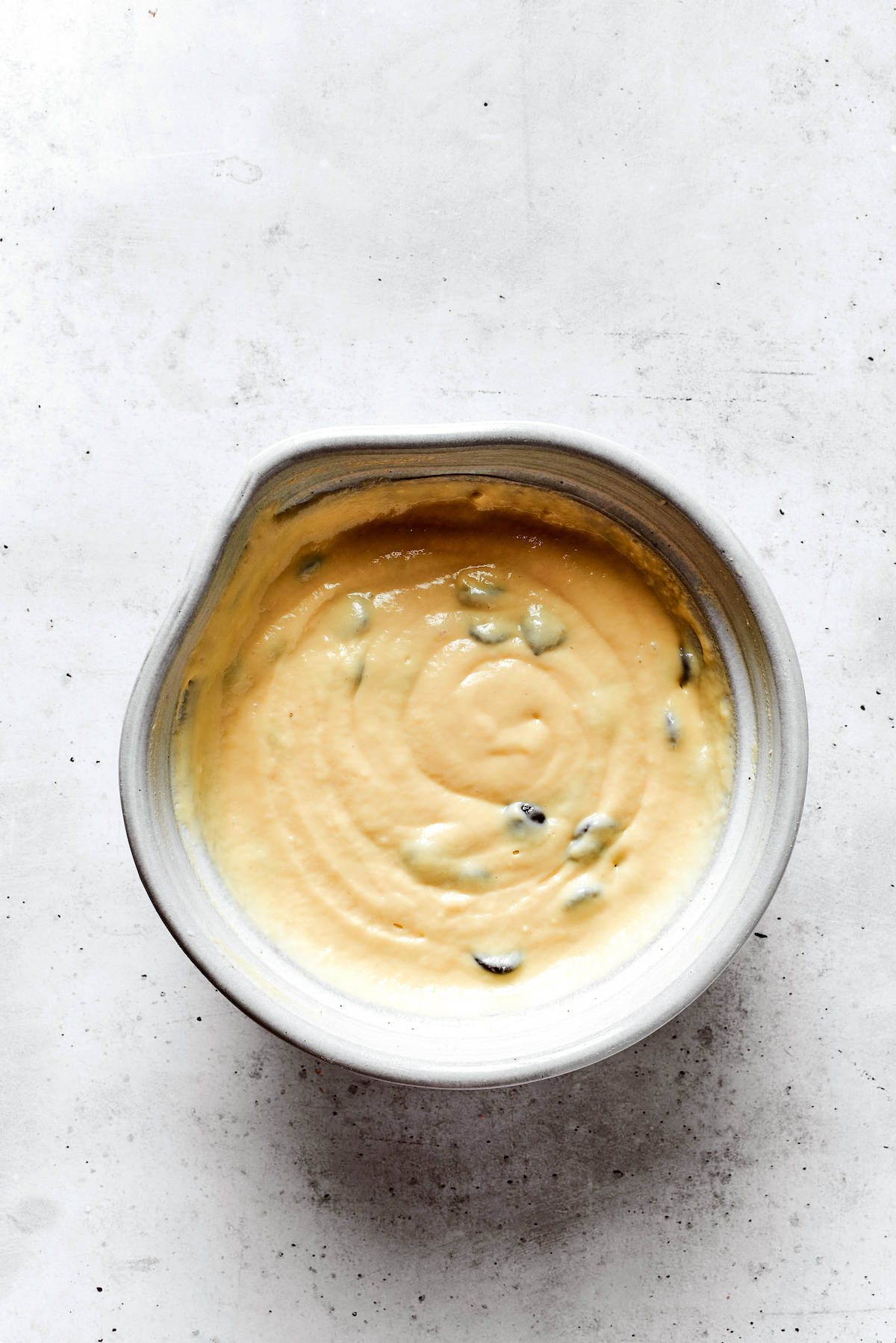 Overhead view of a bowl of chocolate chip pancake batter.