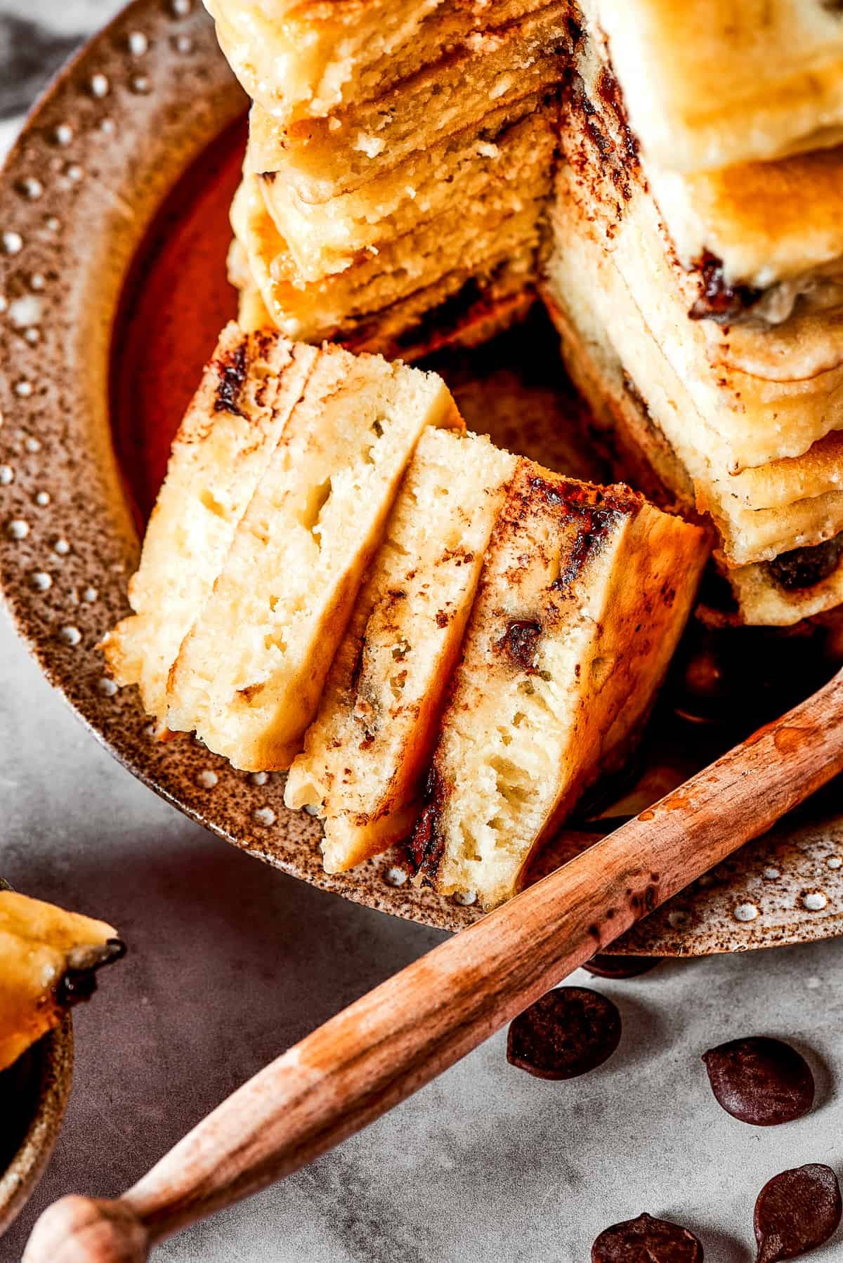 Close up of a bite of chocolate chip pancakes.