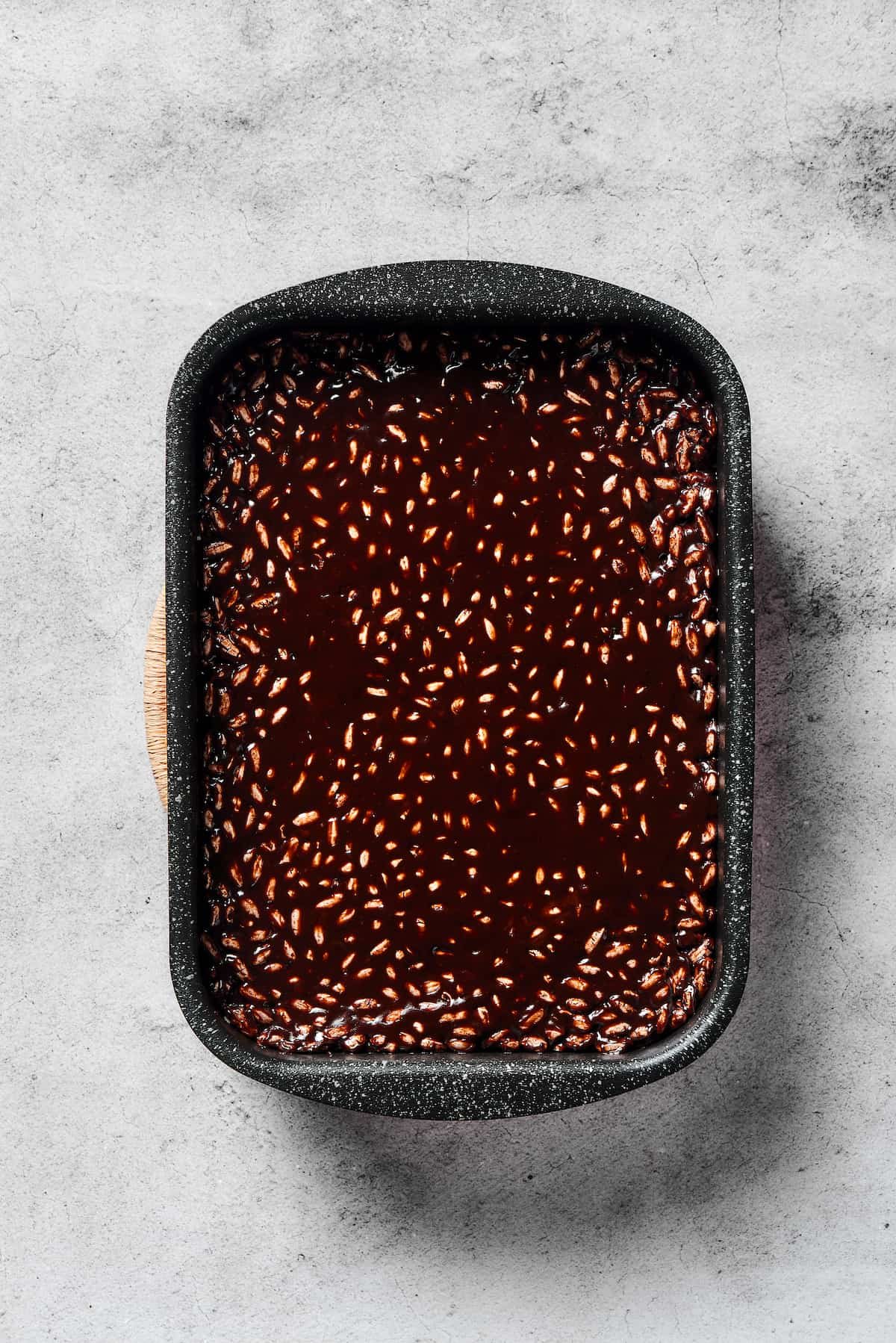 A pan of chocolate rice cereal treats.