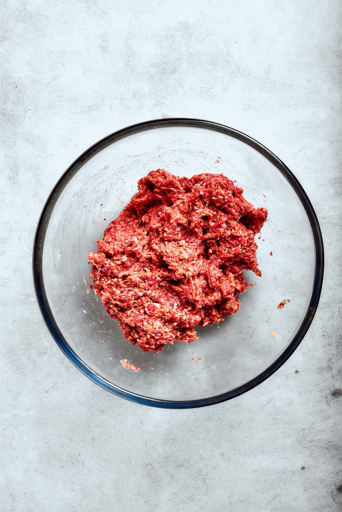 The egg and breadcrumbs are mixed into the meat.