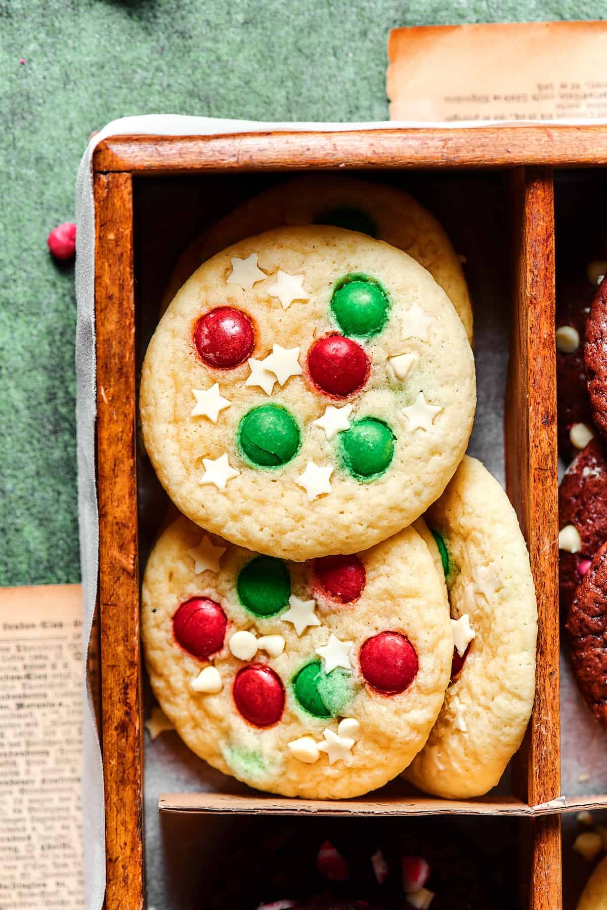 Sugar cookies with red and green M&Ms and white chocolate stars.