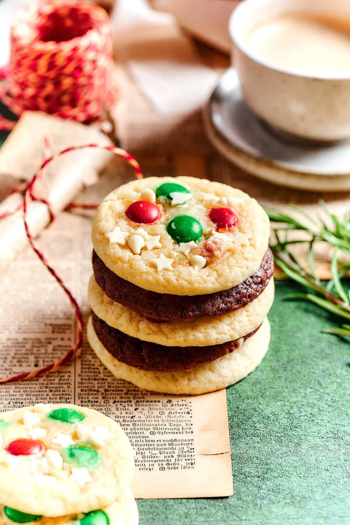 A stack of chocolate cake mix cookies and vanilla cake mix cookies.