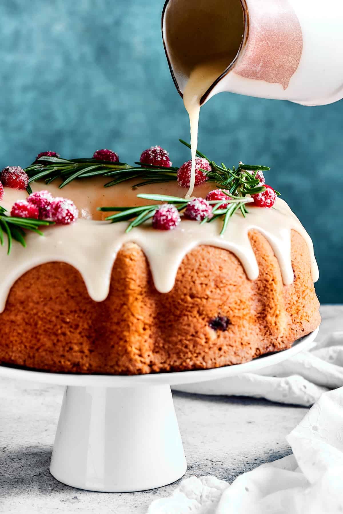 Pouring glaze over a Bundt cake.