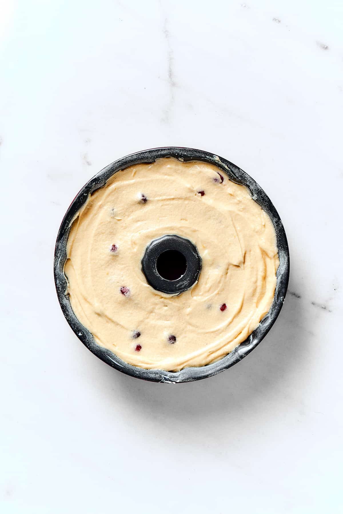 A Bundt pan filled with cake batter.