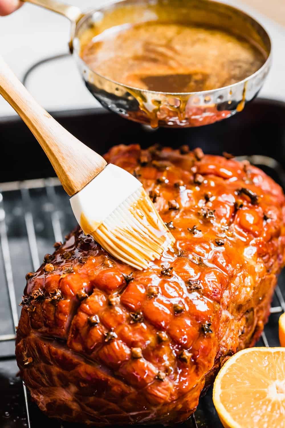 Pouring and Brushing Brown Sugar Glaze Over the Ham