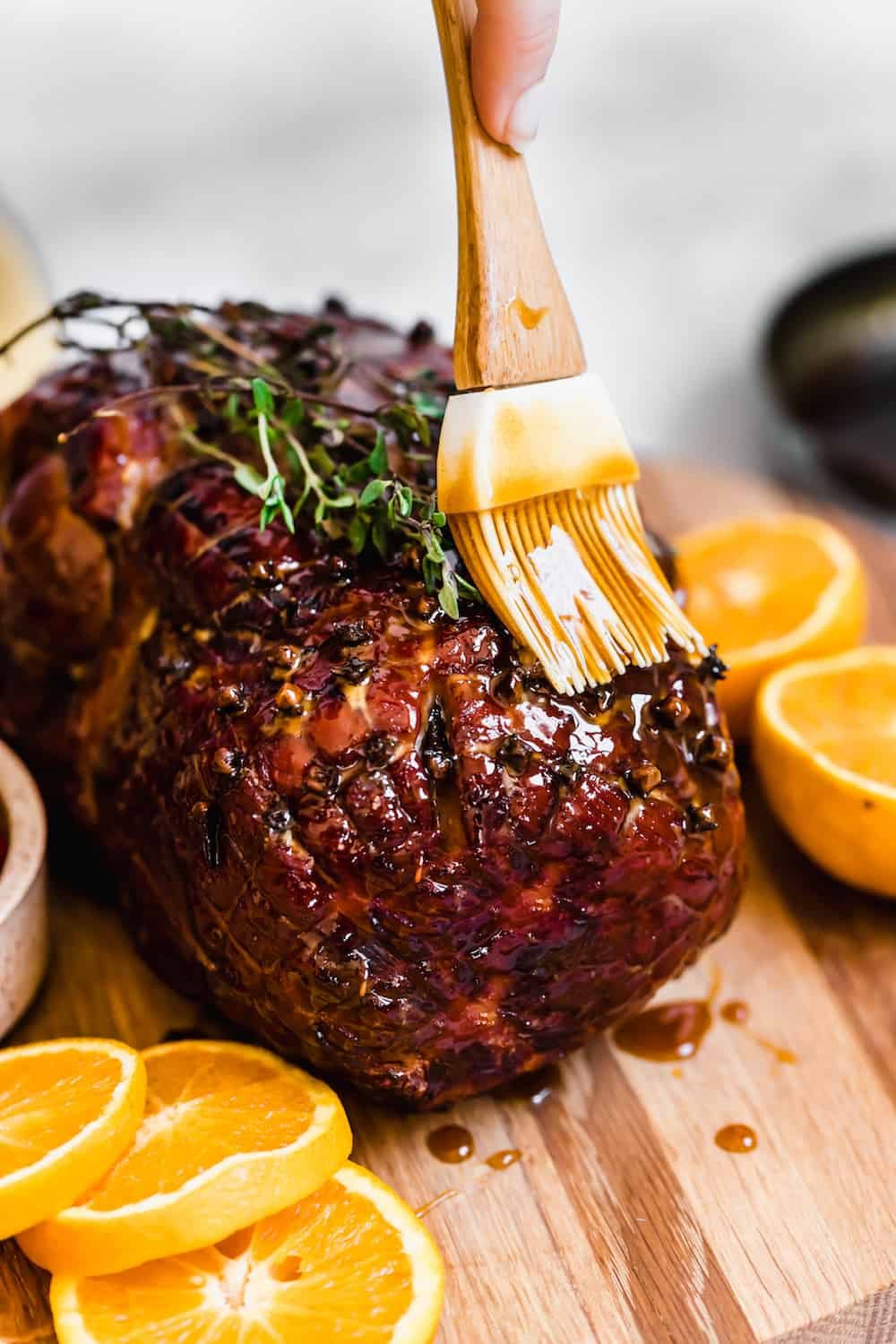 Topping the Cooked Christmas Ham with the Rest of the Glaze
