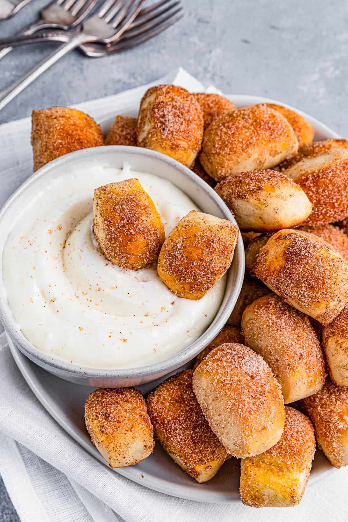 Cinnamon sugar pretzel bites in cream cheese dip