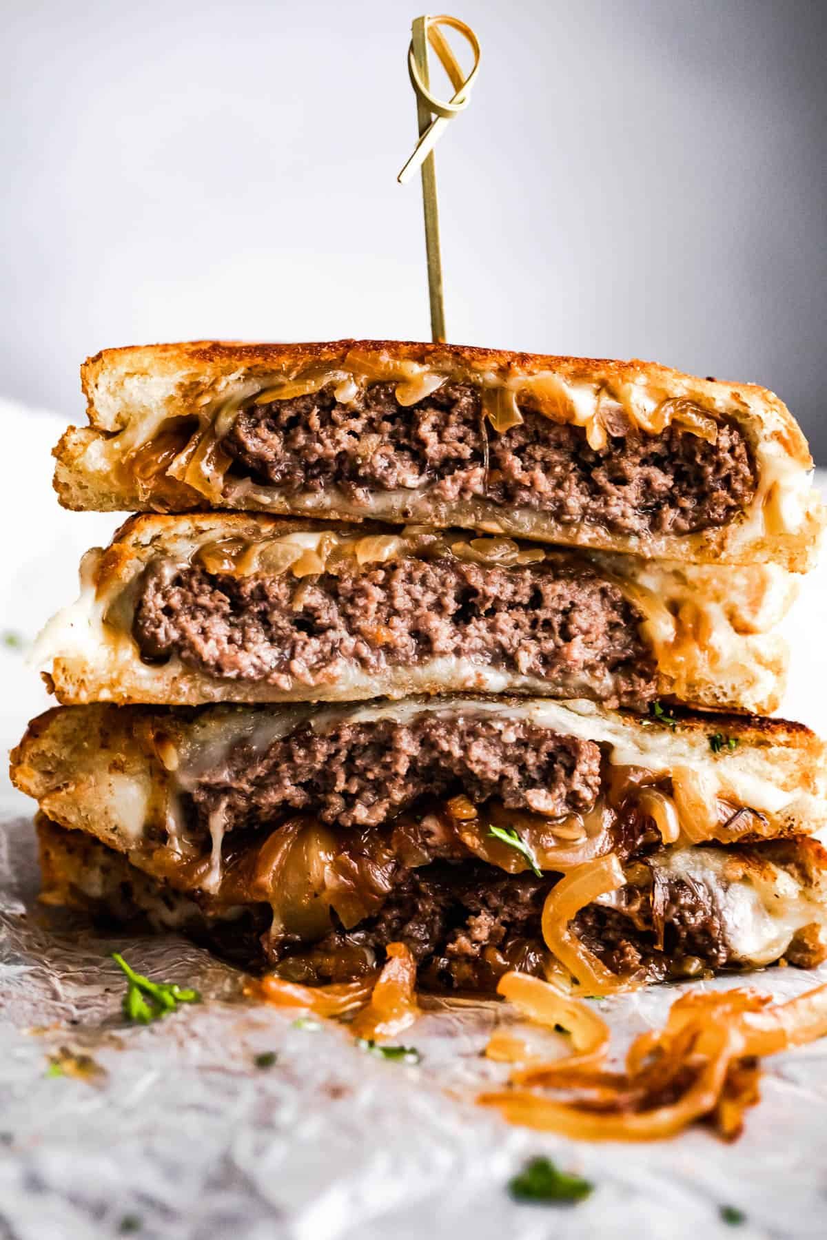 patty melt sandwich cut in halves and stacked up.