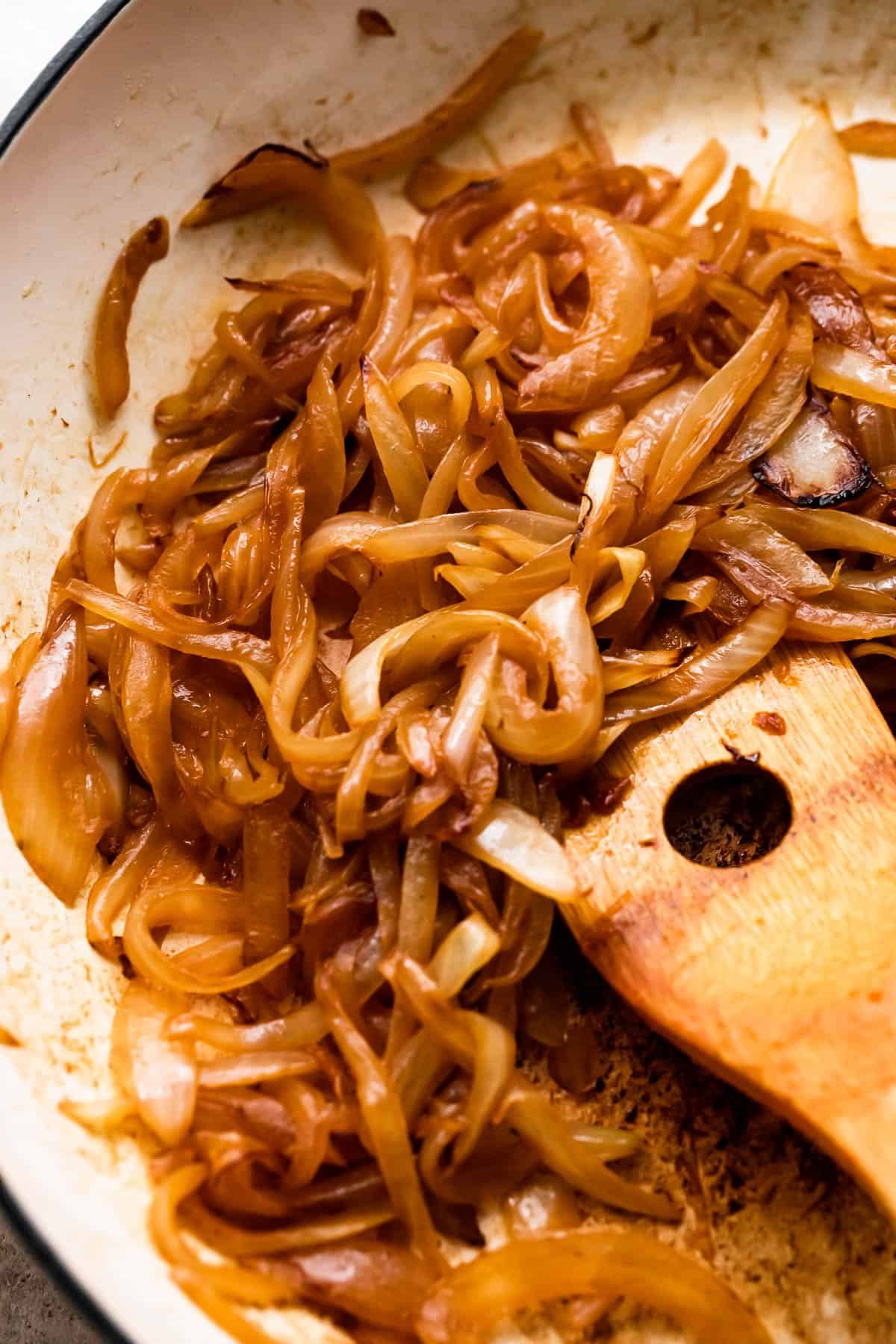 cooking thinly sliced onions in a skillet.