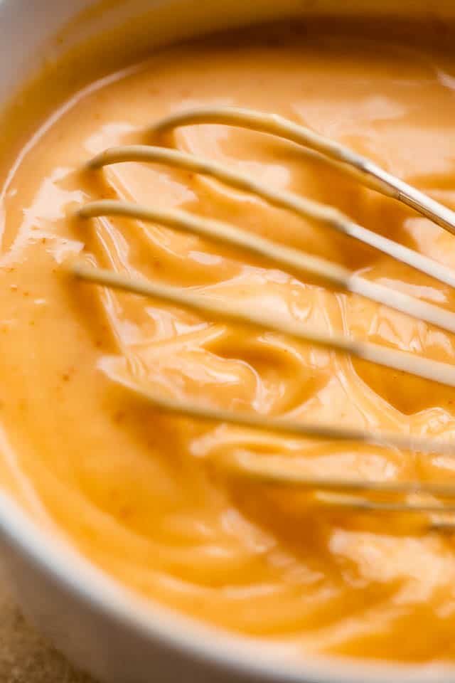 whisking mayo sriracha dipping sauce