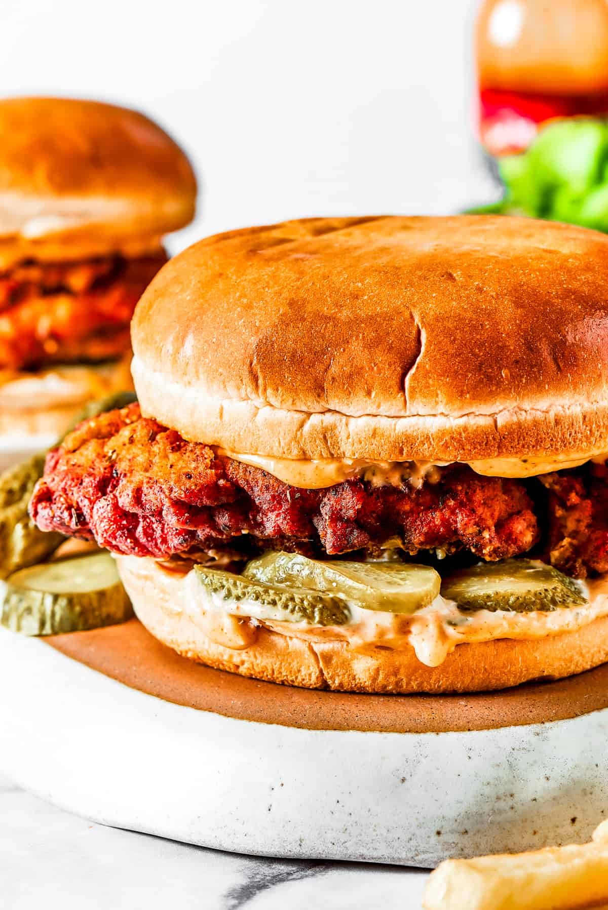 Close-up shot of a fried chicken sandwich.